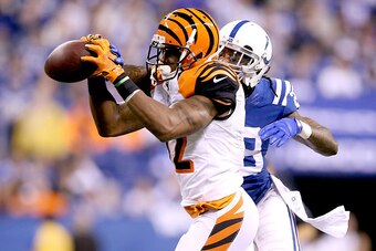 INDIANAPOLIS, IN - JANUARY 04:  Greg Toler #28 of the Indianapolis Colts breaks up a pass to Mohamed Sanu #12 of the Cincinnati Bengals in the second half during their AFC Wild Card game at Lucas Oil Stadium on January 4, 2015 in Indianapolis, Indiana.  (