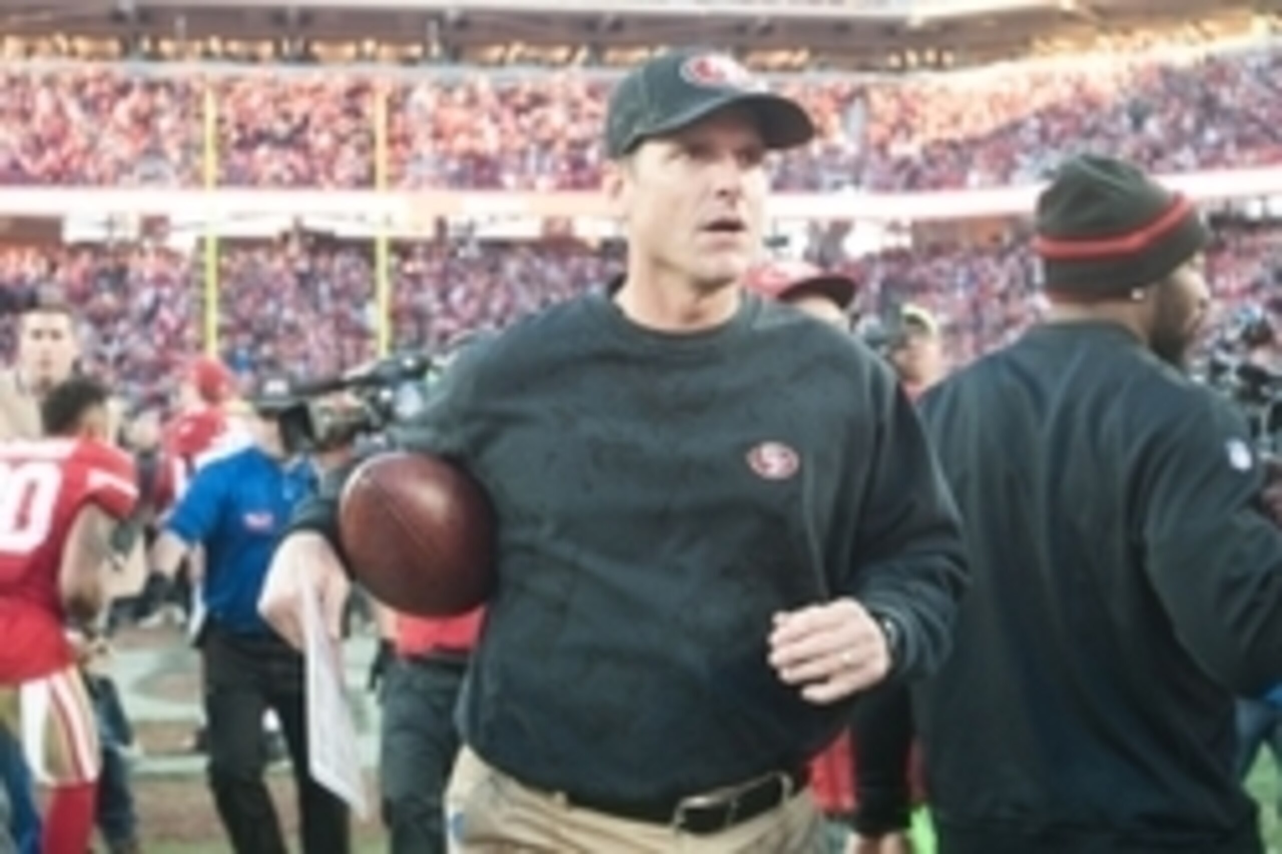 Dec 28, 2014; Santa Clara, CA, USA; San Francisco 49ers head coach Jim Harbaugh leaves the field after defeating the against the Arizona Cardinals 20-17 at Levi's Stadium. Mandatory Credit: Ed Szczepanski-USA TODAY Sports Dec 28, 2014; Santa Clara, CA, USA; San Francisco 49ers head coach Jim Harbaugh leaves the field after defeating the against the Arizona Cardinals 20-17 at Levi's Stadium. Mandatory Credit: Ed Szczepanski-USA TODAY Sports