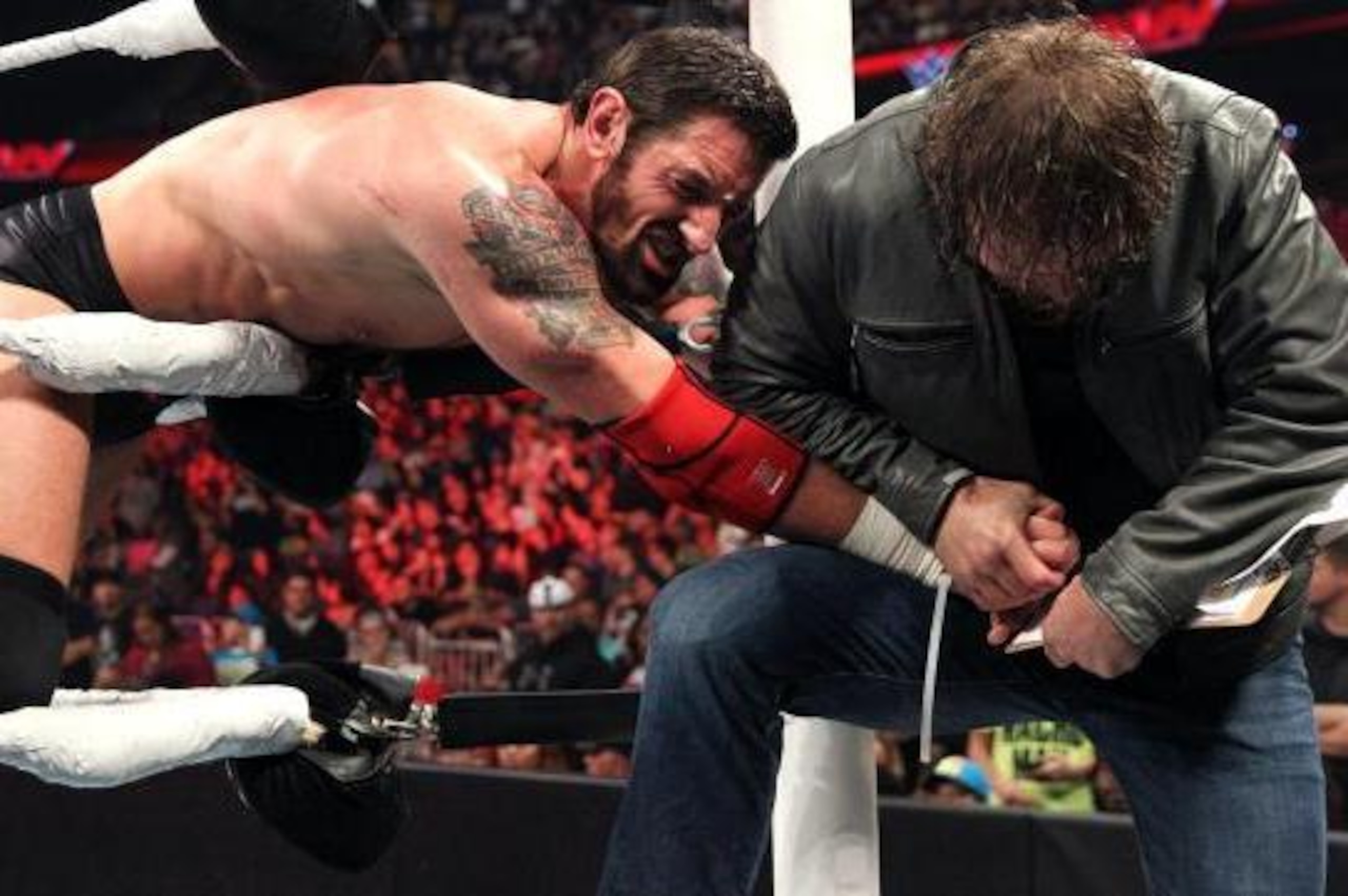Dean Ambrose forces Bad News Barrett to sign a contract for a title match.
