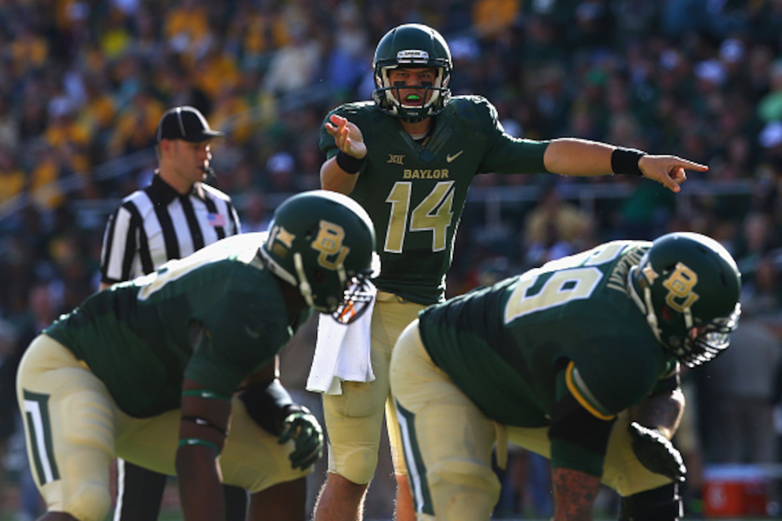 WACO, TX - NOVEMBER 01:  Bryce Petty #14 of the Baylor Bears calls a play against the Kansas Jayhawks at McLane Stadium on November 1, 2014 in Waco, Texas.  (Photo by Ronald Martinez/Getty Images)