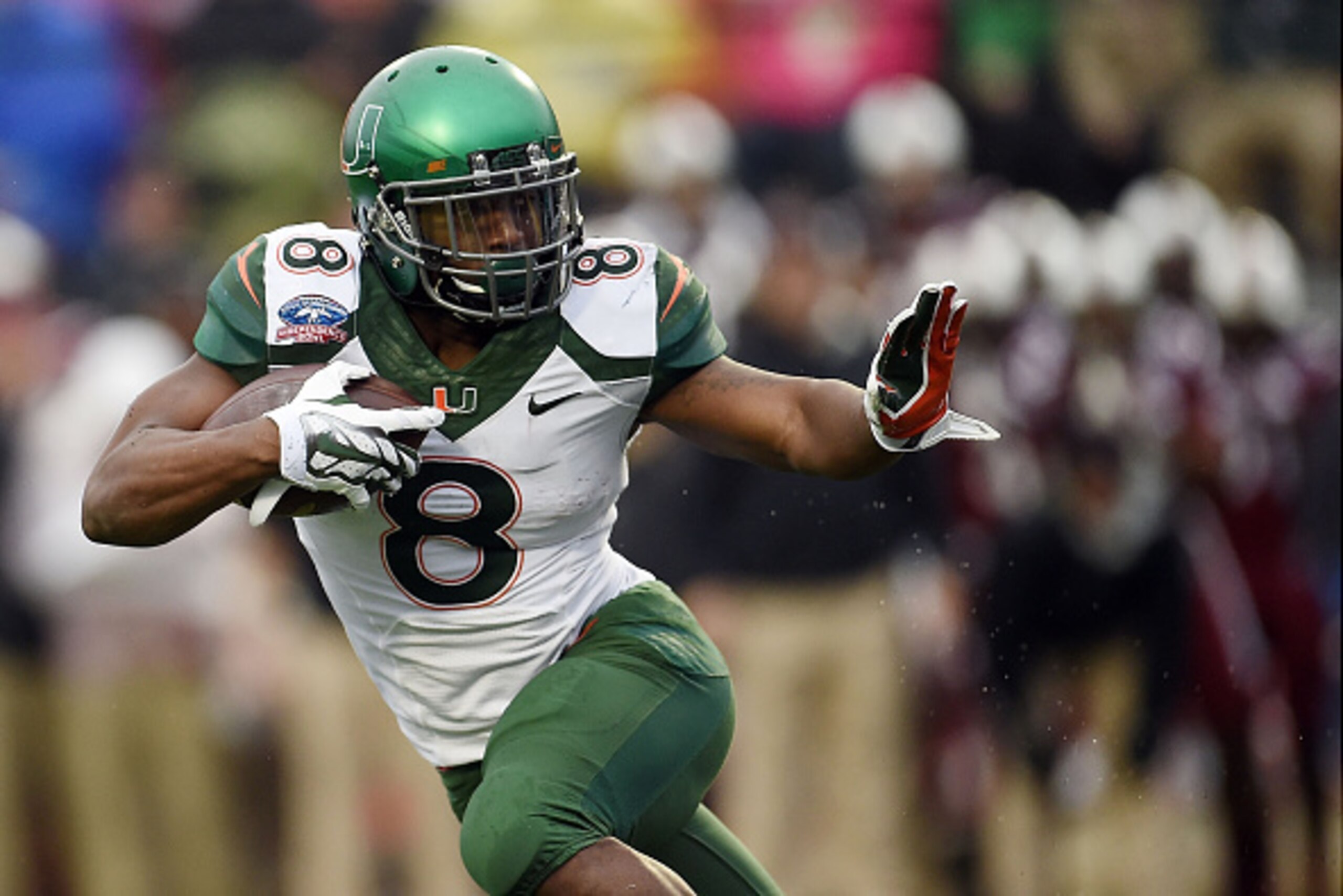 SHREVEPORT, LA - DECEMBER 27: Duke Johnson #8 of the Miami Hurricanes runs for yards against the South Carolina Gamecocks during the first quarter of the Duck Commander Independence Bowl at Independence Stadium on December 27, 2014 in Shreveport, Louisian SHREVEPORT, LA - DECEMBER 27: Duke Johnson #8 of the Miami Hurricanes runs for yards against the South Carolina Gamecocks during the first quarter of the Duck Commander Independence Bowl at Independence Stadium on December 27, 2014 in Shreveport, Louisian
