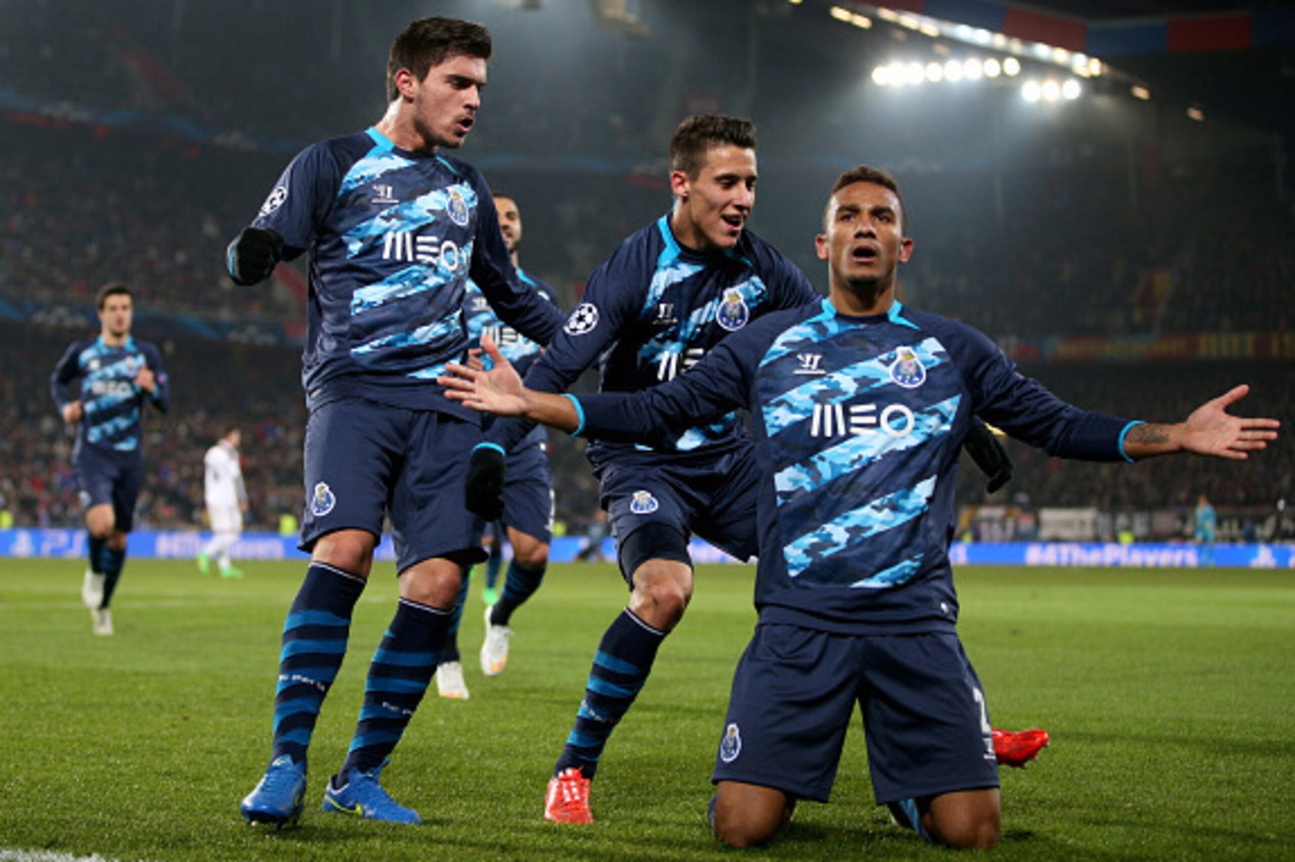 BASEL, SWITZERLAND - FEBRUARY 18: Danilo (R) of FC Porto celebrates with teammates after scoring his team's first goal during the UEFA Champions League Round of 16 match between FC Basel 1893 and FC Porto at St. Jakob-Park on February 18, 2015 in Basel, S BASEL, SWITZERLAND - FEBRUARY 18: Danilo (R) of FC Porto celebrates with teammates after scoring his team's first goal during the UEFA Champions League Round of 16 match between FC Basel 1893 and FC Porto at St. Jakob-Park on February 18, 2015 in Basel, S