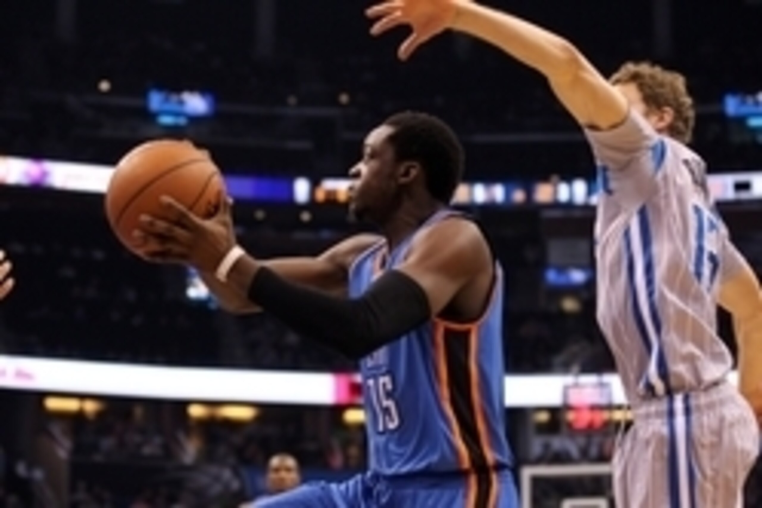 Jan 18, 2015; Orlando, FL, USA; Oklahoma City Thunder guard Reggie Jackson (15) drives to the basket as Orlando Magic guard Luke Ridnour (13) defends during the first quarter at Amway Center. Mandatory Credit: Kim Klement-USA TODAY Sports