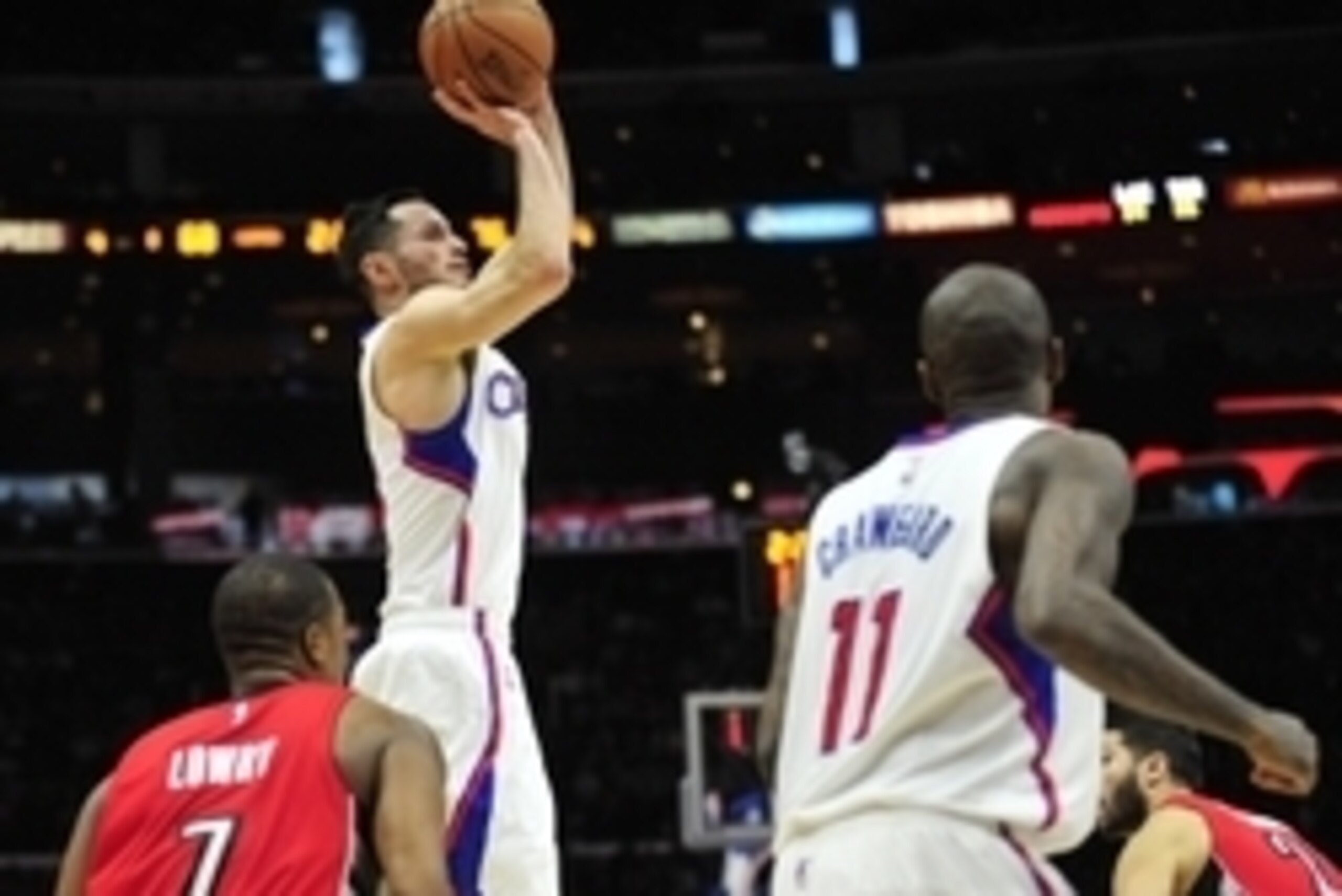 December 27, 2014; Los Angeles, CA, USA; Los Angeles Clippers guard J.J. Redick (4) shoots a three point basket against the Toronto Raptors during the second half at Staples Center. Mandatory Credit: Gary A. Vasquez-USA TODAY Sports