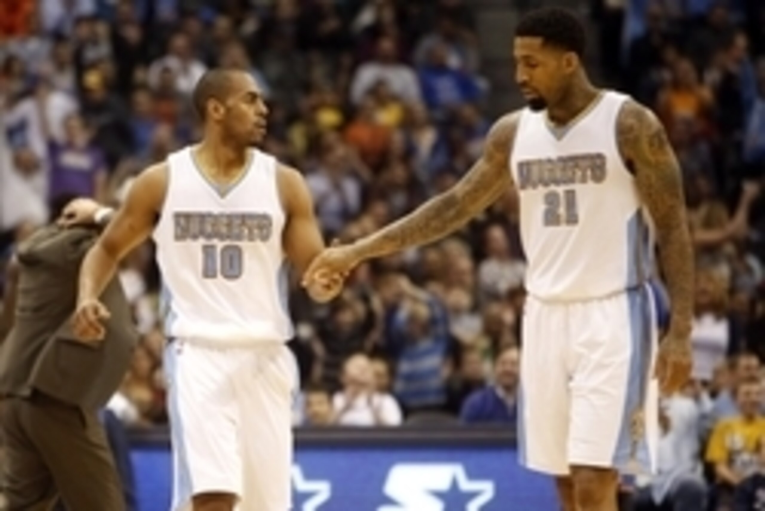 Nov 19, 2014; Denver, CO, USA; Denver Nuggets forward Wilson Chandler (21) and Denver Nuggets guard Arron Afflalo (10) celebrate during the second half against the Oklahoma City Thunder at Pepsi Center. The Nuggets won 107-100.  Mandatory Credit: Chris Hu