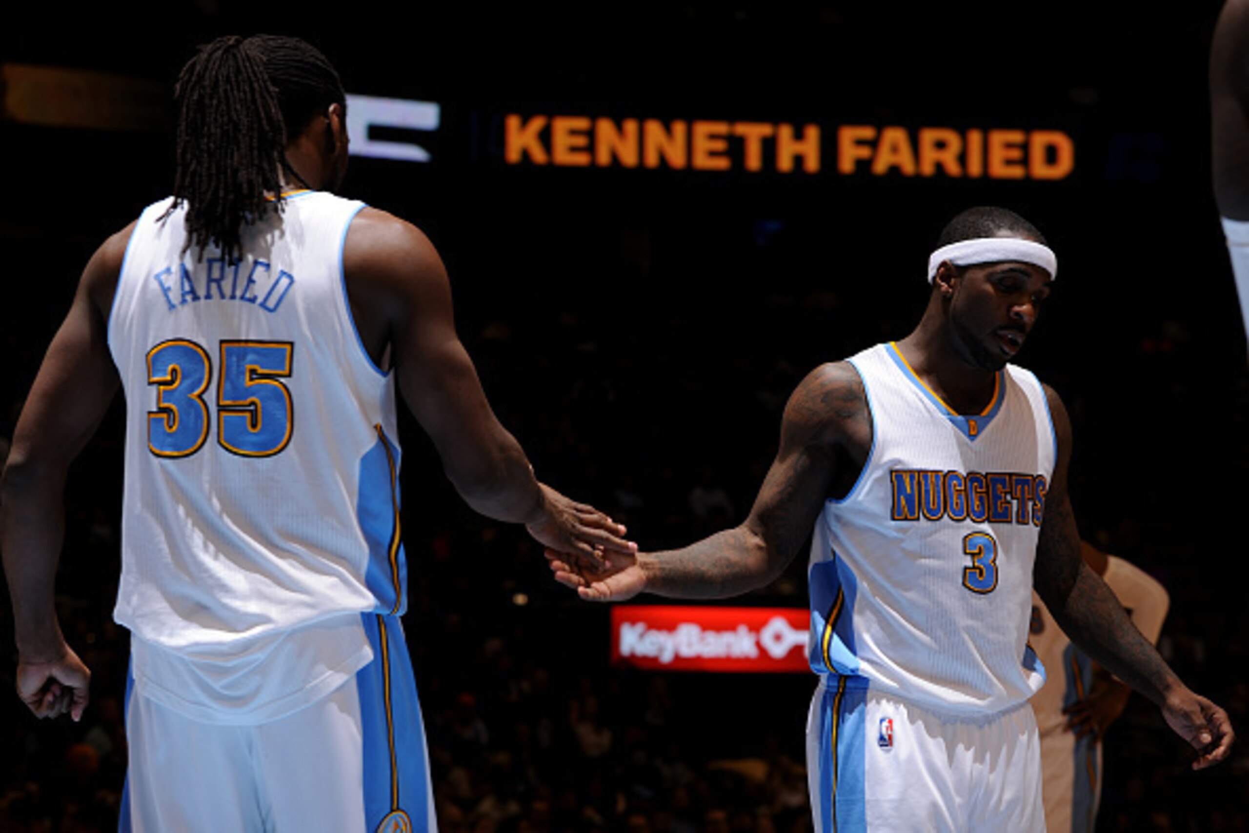 DENVER, CO - January 14: Kenneth Faried #35 and Ty Lawson #3 of the Denver Nuggets celebrate during a game against the Dallas Mavericks on January 14, 2015 at the Pepsi Center in Denver, Colorado. NOTE TO USER: User expressly acknowledges and agrees that,