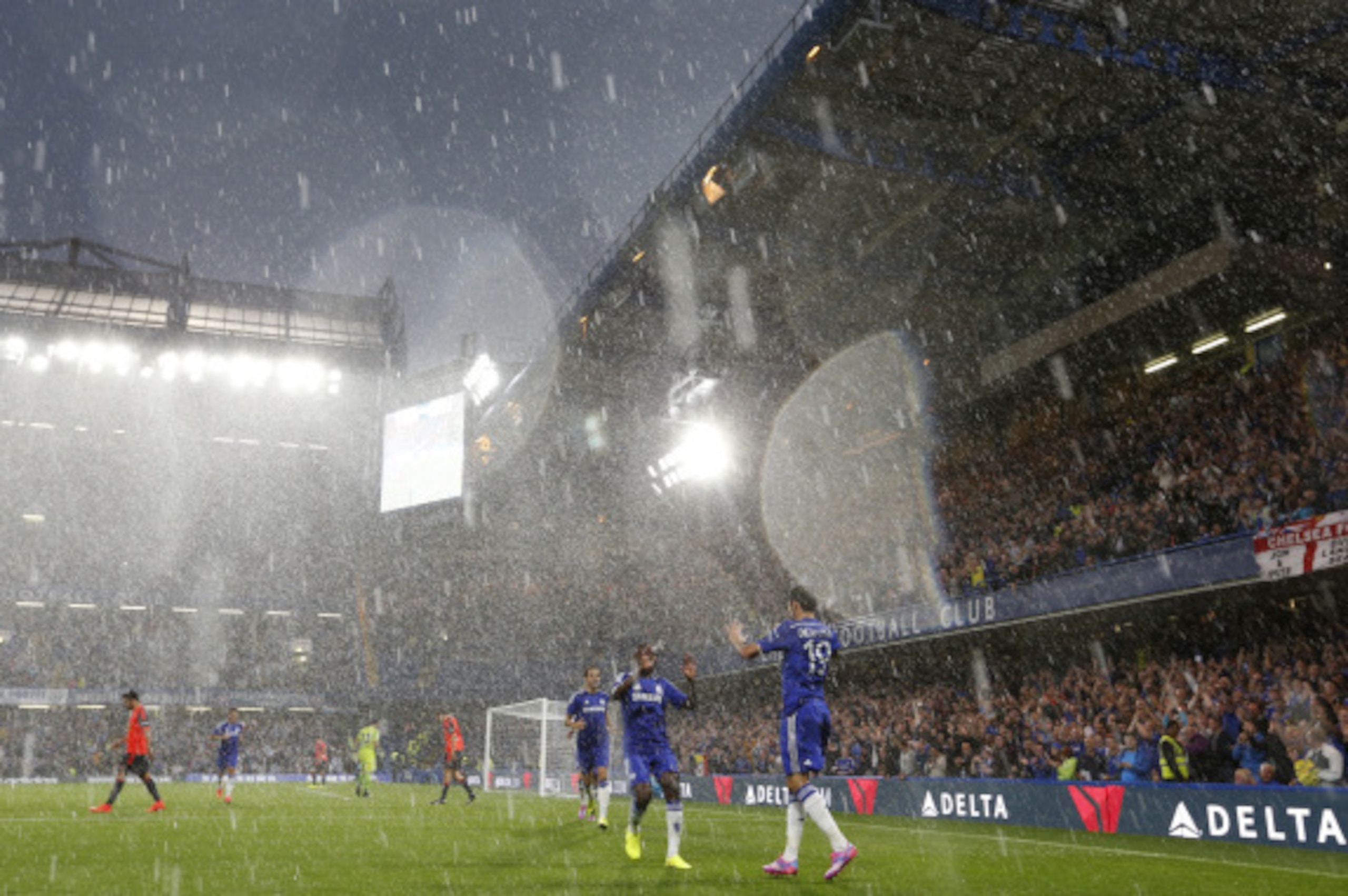 LONDON, ENGLAND - AUGUST 12: Diego Costa of Chelsea celebrates after scoring his 1st goal with his team mates during the pre-season friendly match between Chelsea and Real Sociedad at Stamford Bridge on August 12, 2014 in London, England.  (Photo by Steve