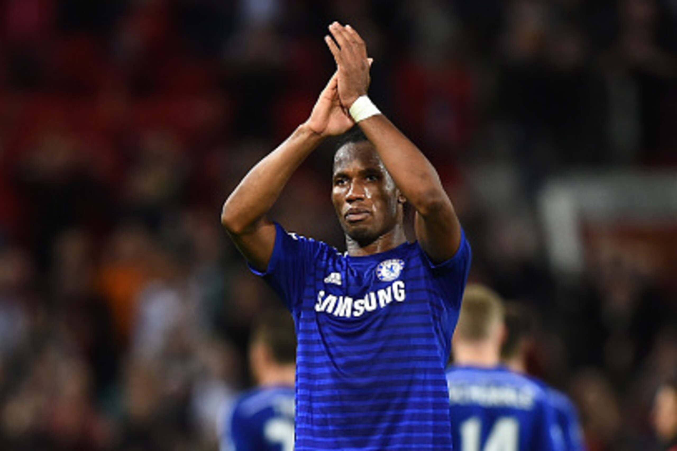 MANCHESTER, ENGLAND - OCTOBER 26:  Didier Drogba of Chelsea salutes the fans at the end of the Barclays Premier League match between Manchester United and Chelsea at Old Trafford on October 26, 2014 in Manchester, England.  (Photo by Laurence Griffiths/Ge