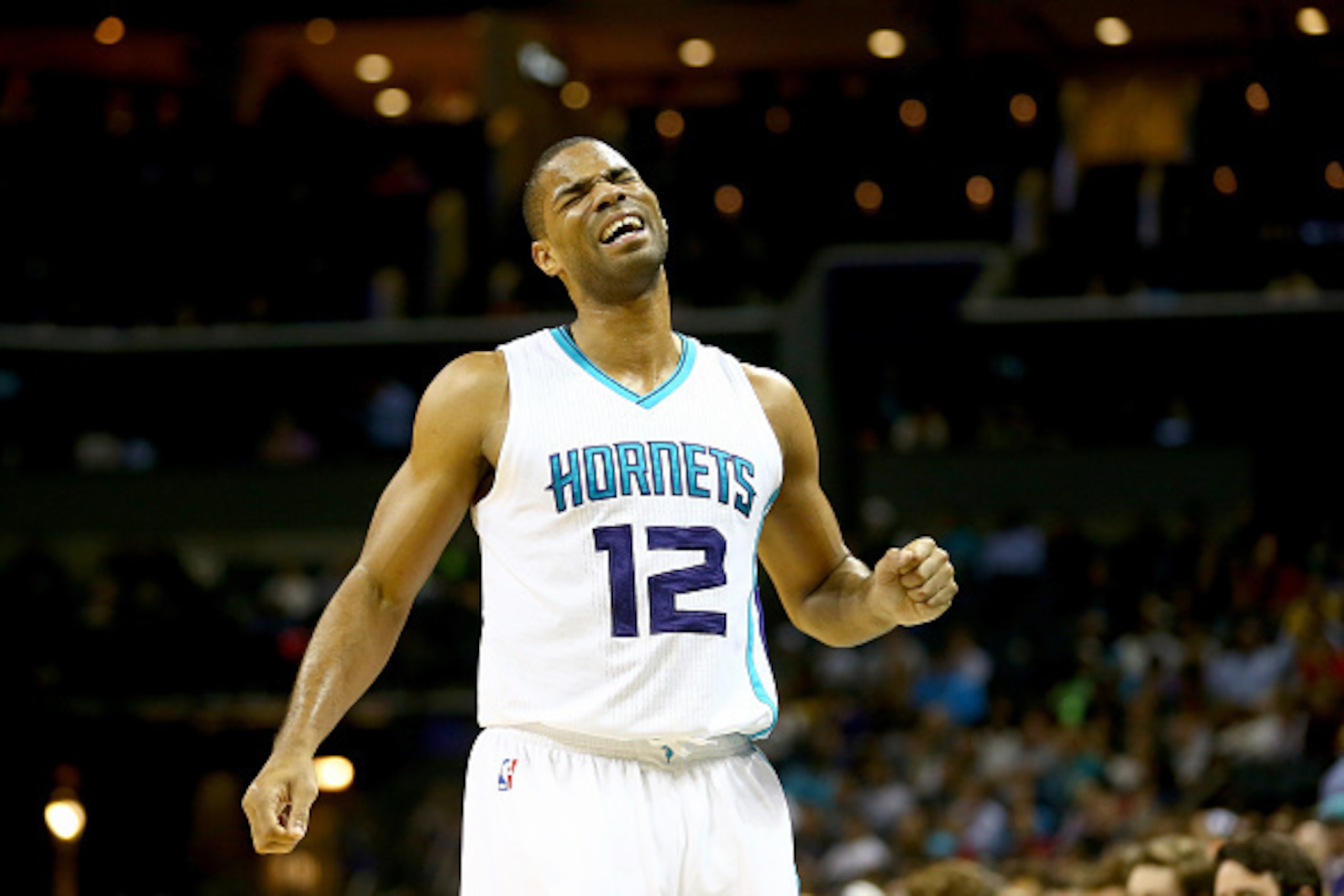 CHARLOTTE, NC - NOVEMBER 24:  Gary Neal #12 of the Charlotte Hornets reacts after an injury against the Los Angeles Clippers during their game at Time Warner Cable Arena on November 24, 2014 in Charlotte, North Carolina.
NOTE TO USER: User expressly ackno