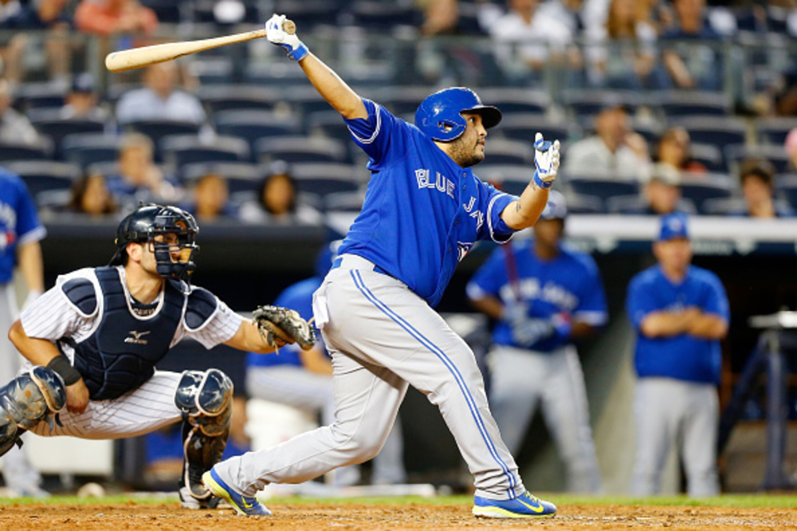 NEW YORK, NY - SEPTEMBER 20:  Dioner Navarro #30 of the Toronto Blue Jays follows through on a ninth inning RBI base hit against the New York Yankees at Yankee Stadium on September 20, 2014 in the Bronx borough of New York City.  (Photo by Jim McIsaac/Get
