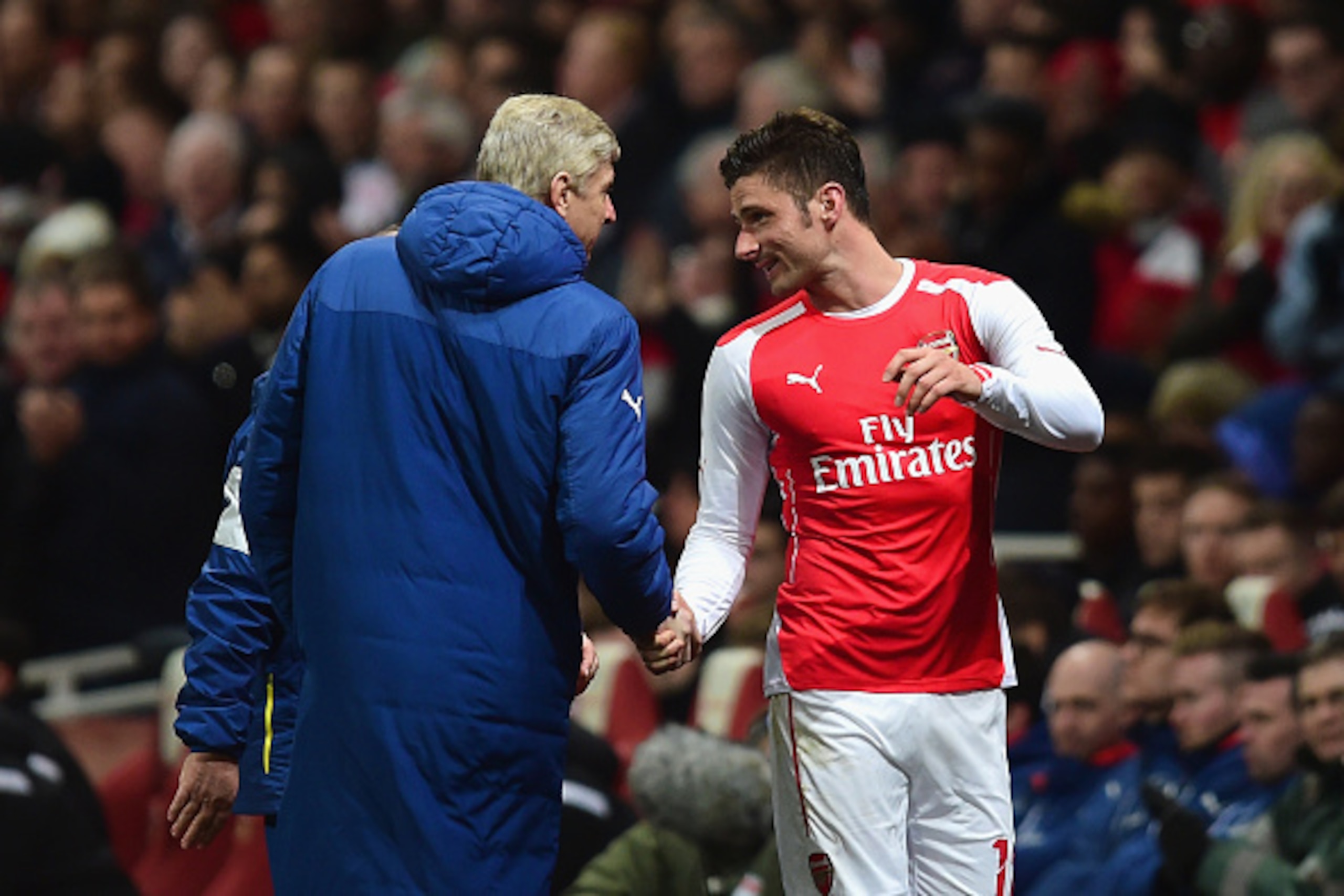 LONDON, ENGLAND - FEBRUARY 15: Arsene Wenger, manager of Arsenal shakes hands with Olivier Giroud of Arsenal during the FA Cup fifth round match between Arsenal and Middlesbrough at Emirates Stadium on February 15, 2015 in London, England. (Photo by Jami LONDON, ENGLAND - FEBRUARY 15: Arsene Wenger, manager of Arsenal shakes hands with Olivier Giroud of Arsenal during the FA Cup fifth round match between Arsenal and Middlesbrough at Emirates Stadium on February 15, 2015 in London, England. (Photo by Jami