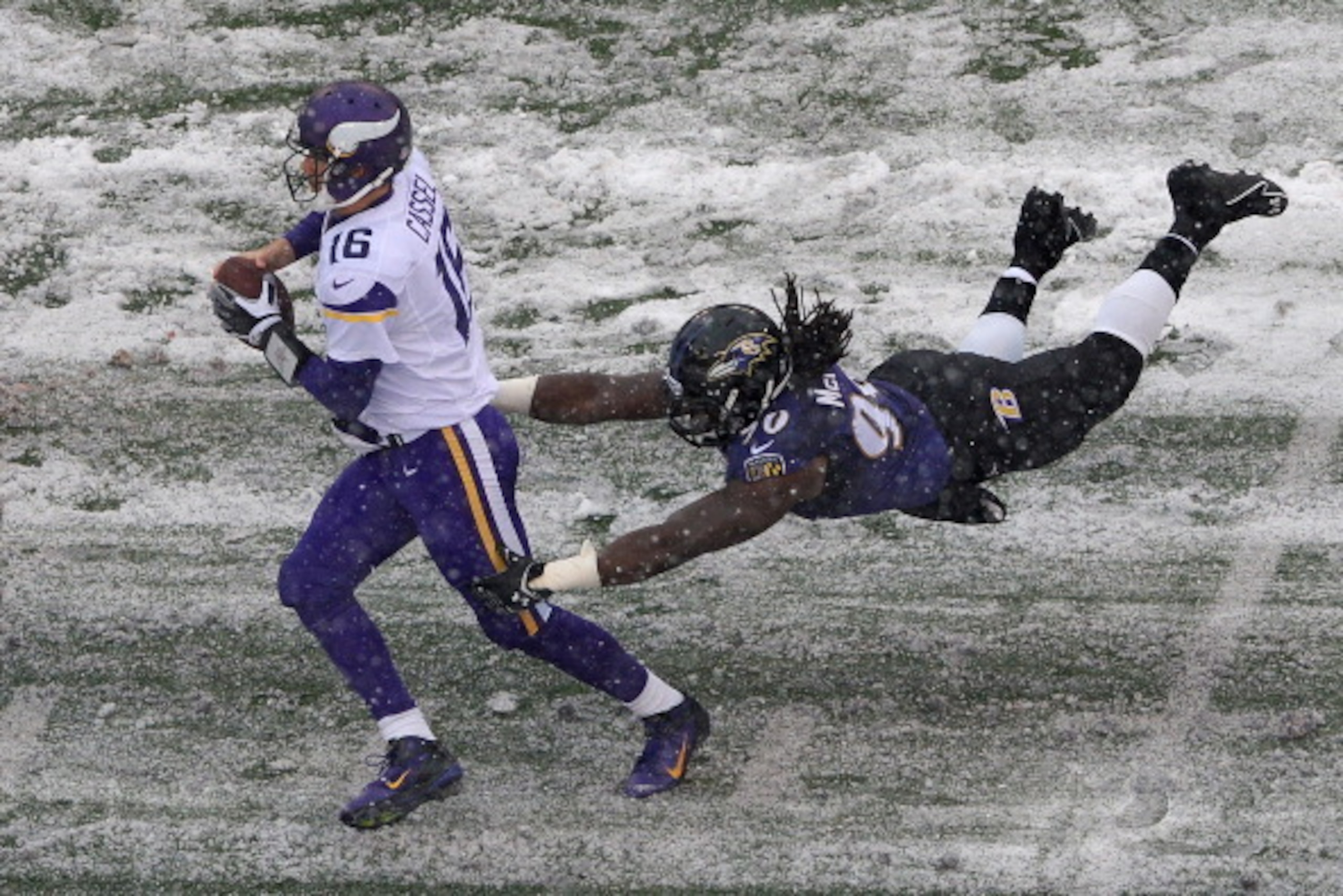 BALTIMORE, MD - DECEMBER 08: Quarterback Matt Cassel #16 of the Minnesota Vikings avoids being sacked by linebacker Pernell McPhee #90 of the Baltimore Ravens in the second quarter at M&T Bank Stadium on December 8, 2013 in Baltimore, Maryland. (Photo by
