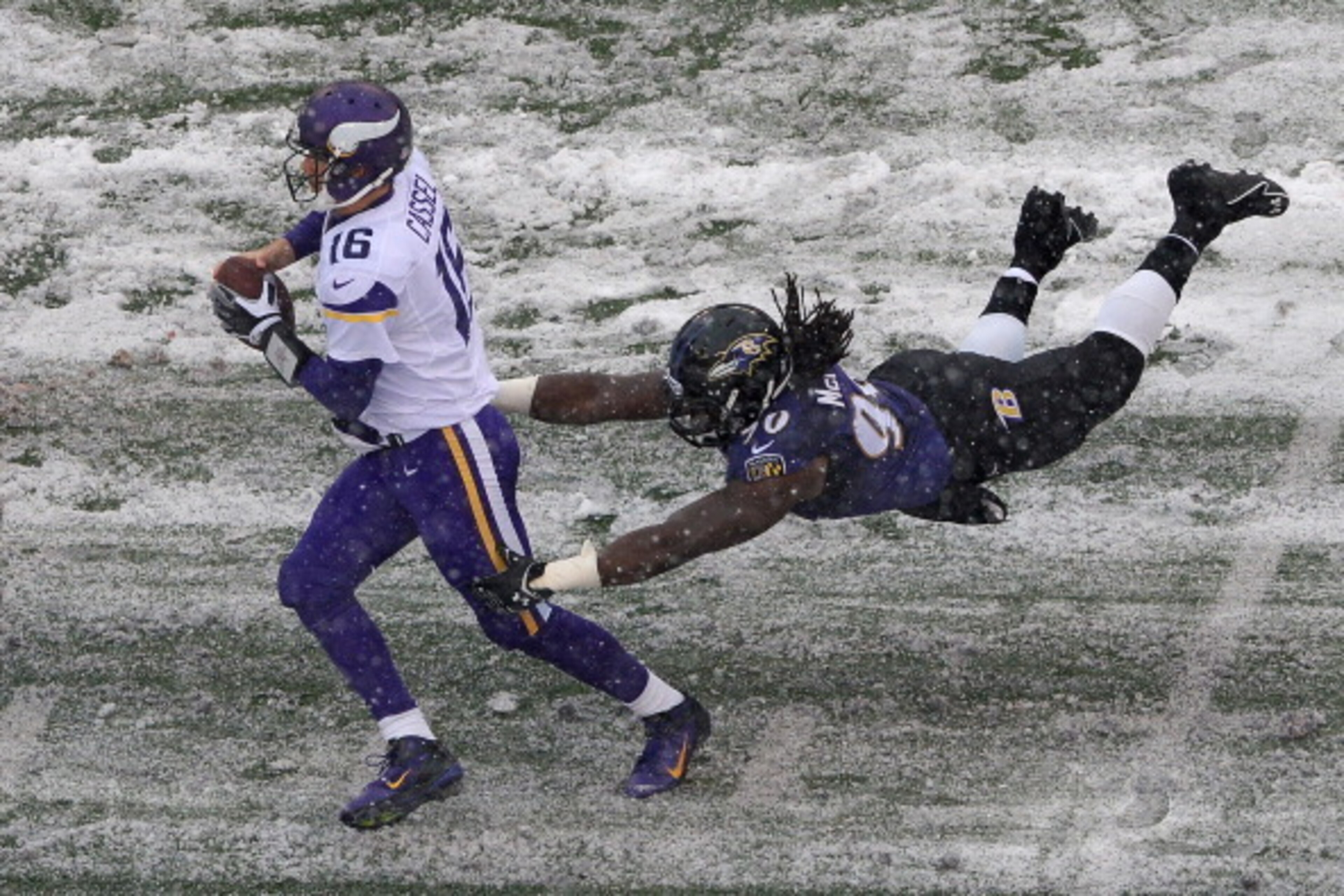 BALTIMORE, MD - DECEMBER 08: Quarterback Matt Cassel #16 of the Minnesota Vikings avoids being sacked by linebacker Pernell McPhee #90 of the Baltimore Ravens in the second quarter at M&T Bank Stadium on December 8, 2013 in Baltimore, Maryland. (Photo by