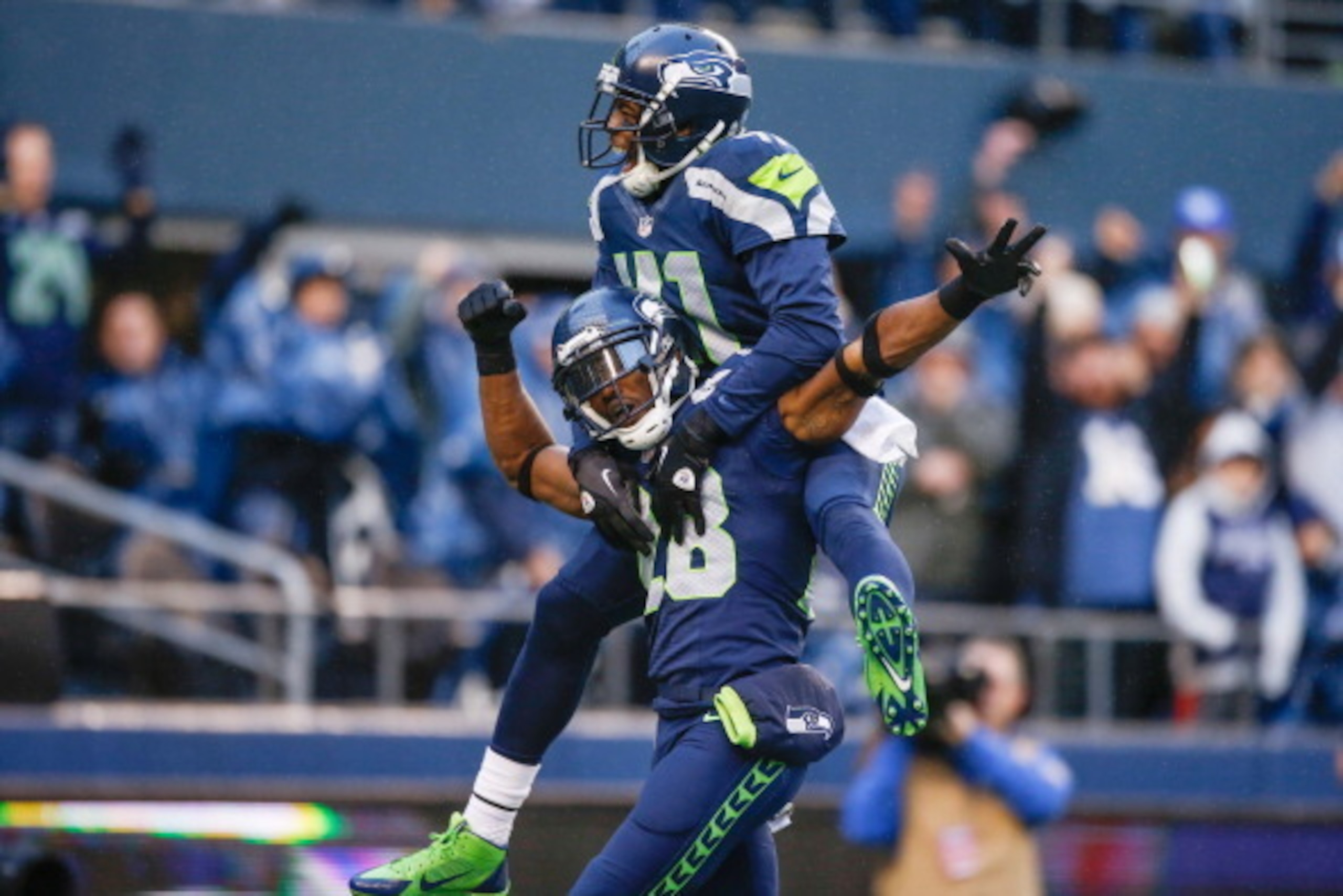 SEATTLE, WA - NOVEMBER 17:  Cornerback Walter Thurmond #28 of the Seattle Seahawks is congratulated by defensive back Byron Maxwell #41 after returning an interception for a touchdown against the Minnesota Vikings at CenturyLink Field on November 17, 2013