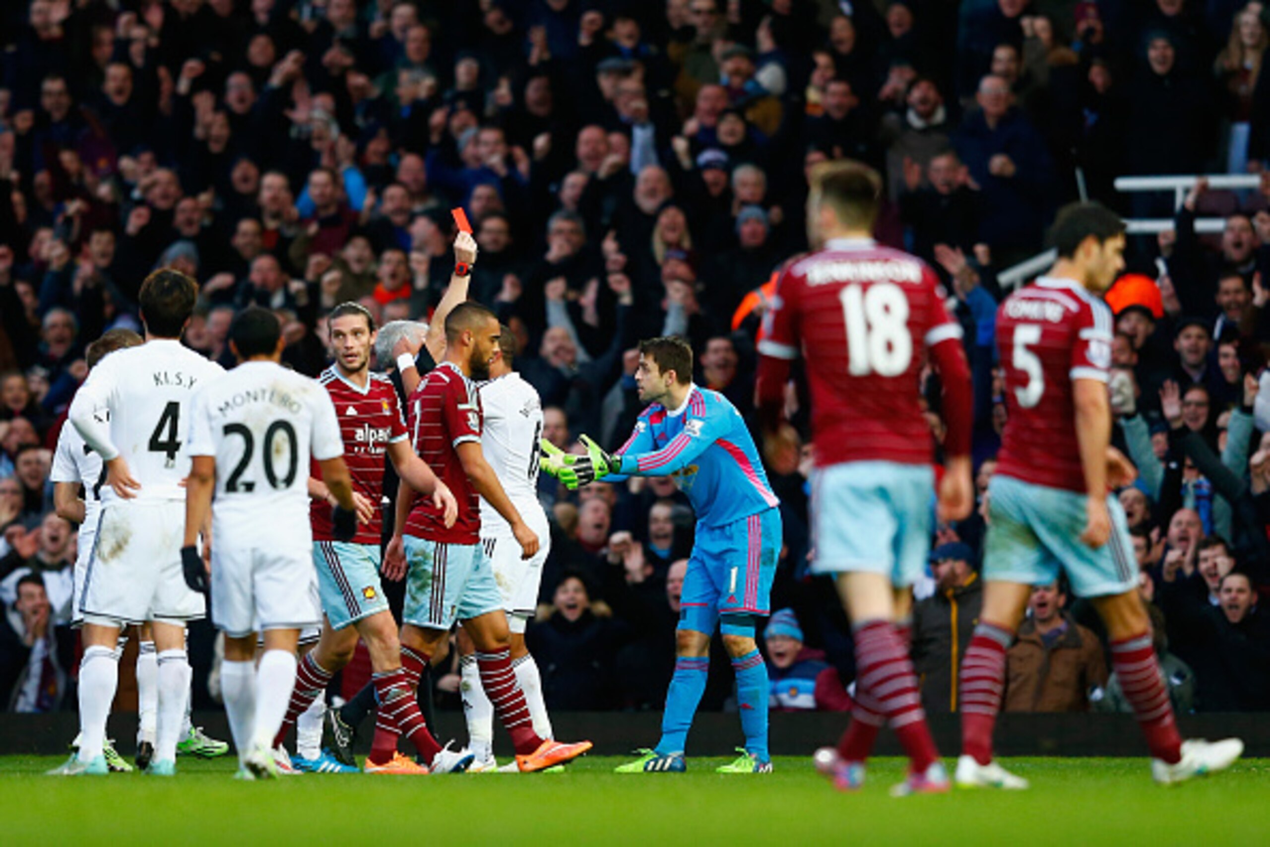 LONDON, ENGLAND - DECEMBER 07:  Referee Chris Foy shows Lukasz Fabianski of Swansea City a red card during the Barclays Premier League match between West Ham United and Swansea City at Boleyn Ground on December 7, 2014 in London, England.  (Photo by Julia