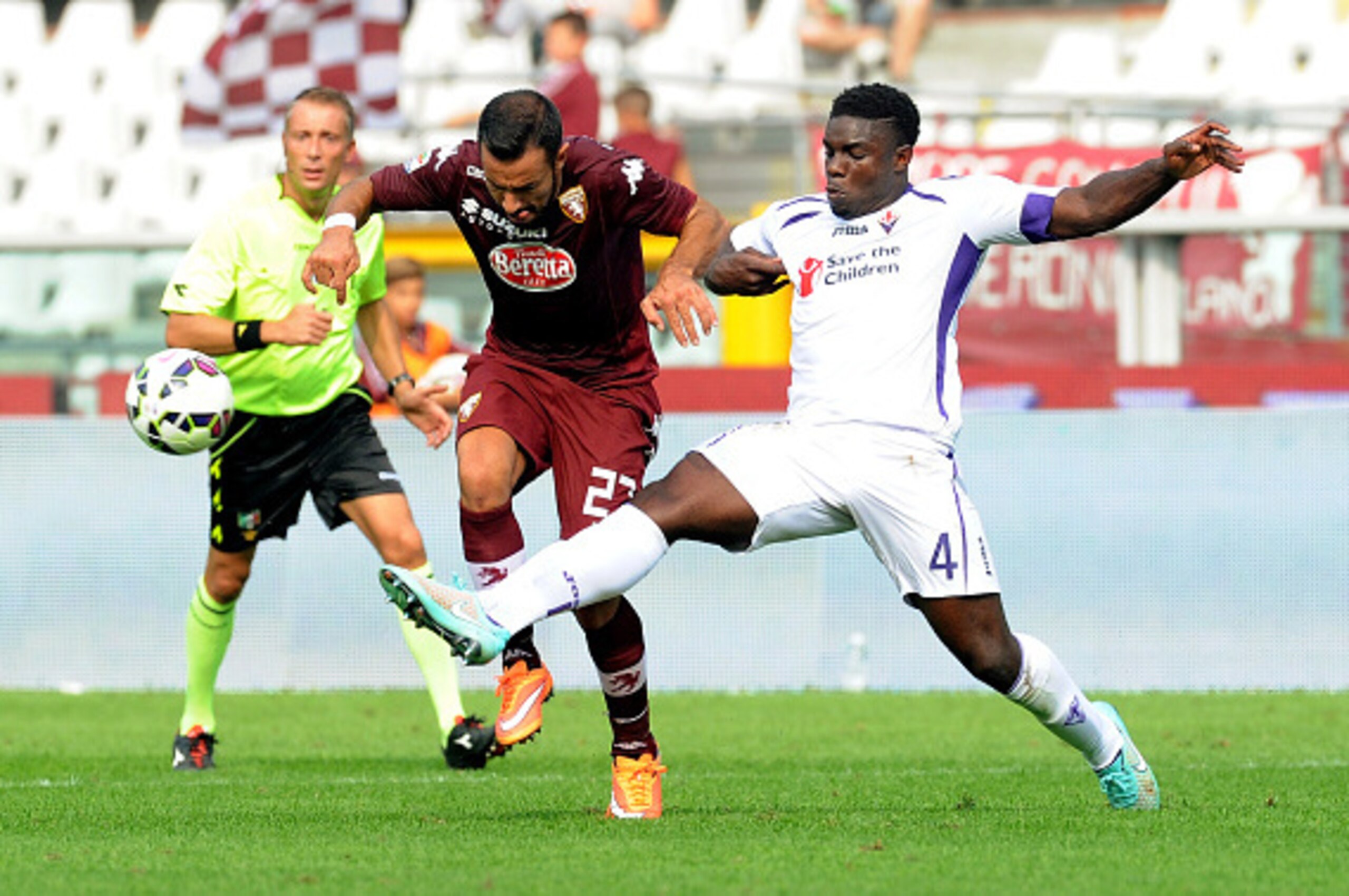 TURIN, ITALY - SEPTEMBER 28: (L-R) Fabio Quagliarella of Torino FC competes for the ball against Micah Richards of AFC Fiorentina during the Serie A match between Torino FC and ACF Fiorentina at Stadio Olimpico di Torino on September 28, 2014 in Turin, It