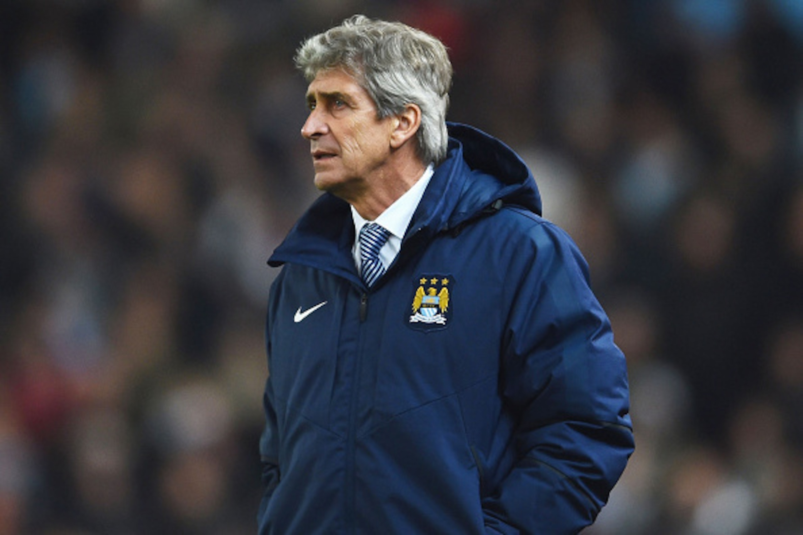 STOKE ON TRENT, ENGLAND - FEBRUARY 11:  Manuel Pellegrini, manager of Manchester City looks on during the Barclays Premier League match between Stoke City and Manchester City at Britannia Stadium on February 11, 2015 in Stoke on Trent, England.  (Photo by