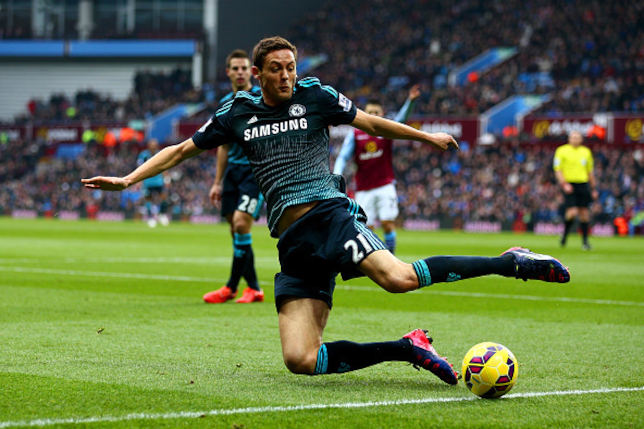 BIRMINGHAM, ENGLAND - FEBRUARY 07:  Nemanja Matic of Chelsea attempts to stop the ball from going out of play during the Barclays Premier League match between Aston Villa and Chelsea at Villa Park on February 7, 2015 in Birmingham, England.  (Photo by Cli