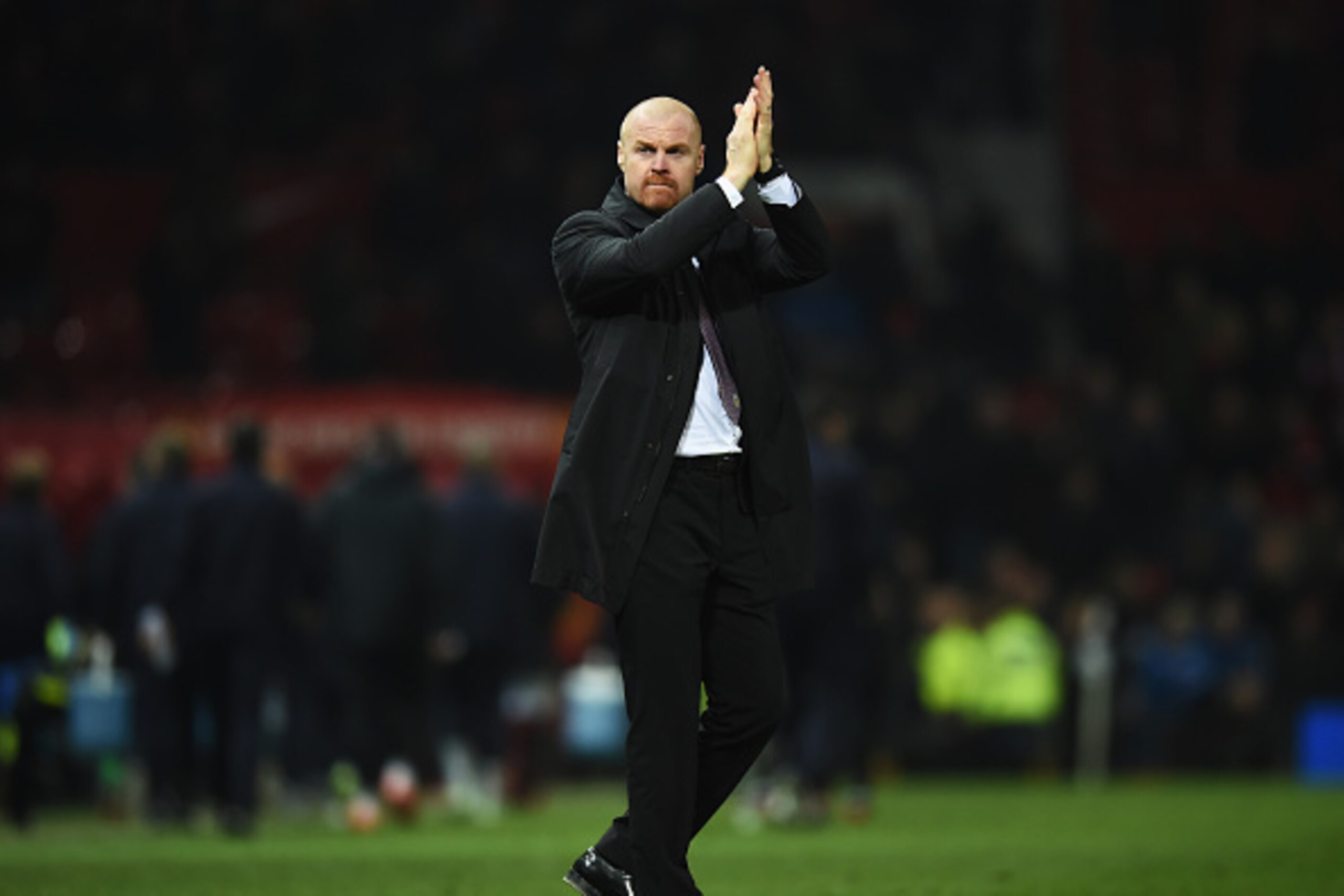 MANCHESTER, ENGLAND - FEBRUARY 11: Sean Dyche, manager of Burnley applauds the fans after the Barclays Premier League match between Manchester United and Burnley at Old Trafford on February 11, 2015 in Manchester, England.  (Photo by Michael Regan/Getty I