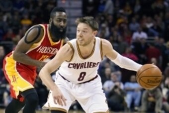 Jan 7, 2015; Cleveland, OH, USA; Cleveland Cavaliers guard Matthew Dellavedova (8) drives past Houston Rockets guard James Harden (13) during the first quarter at Quicken Loans Arena. Mandatory Credit: Ron Schwane-USA TODAY Sports