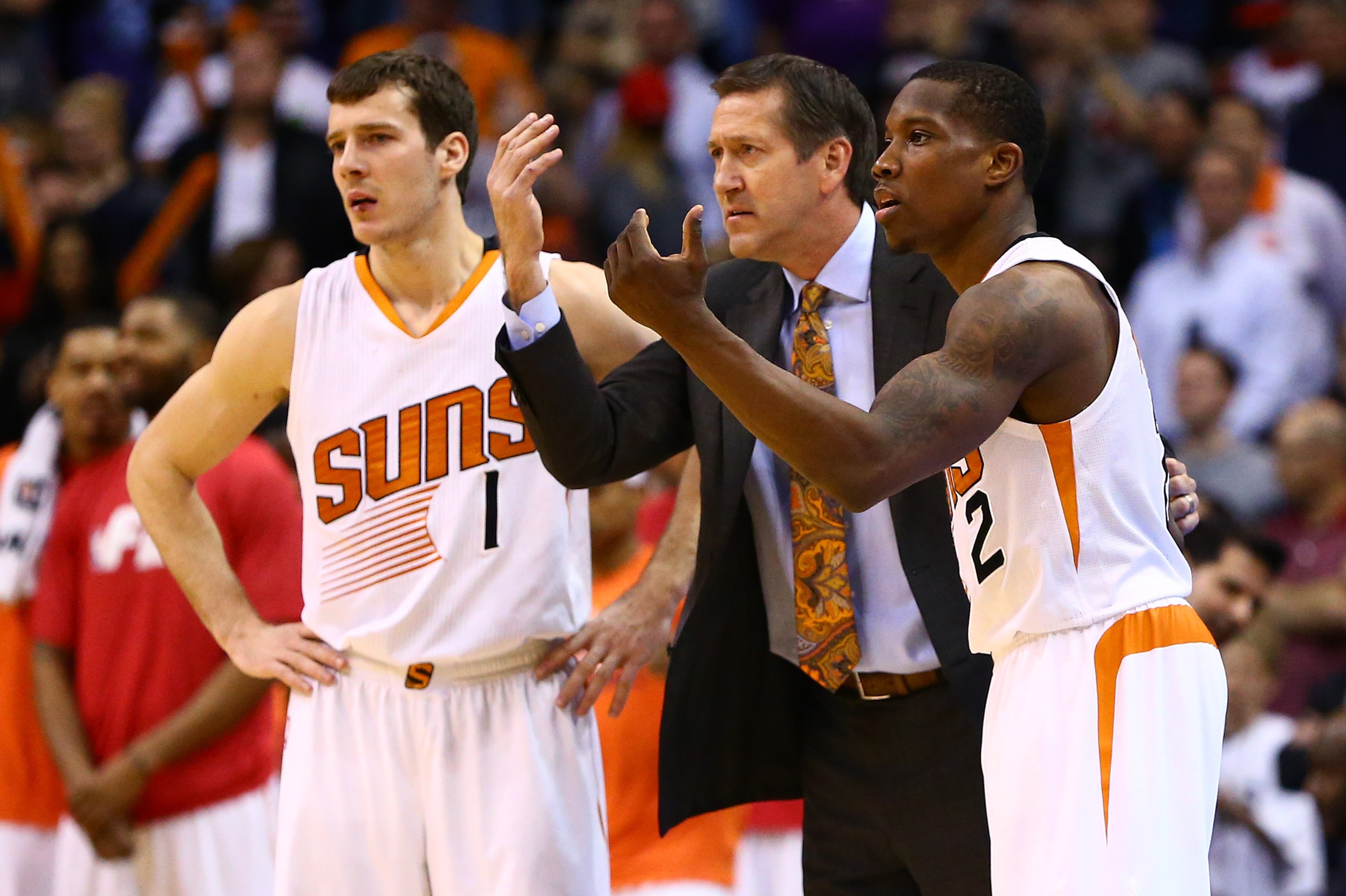 Jan 21, 2015; Phoenix, AZ, USA; Phoenix Suns head coach Jeff Hornacek (center) reacts alongside guard Eric Bledsoe (2) and guard Goran Dragic (1) in the fourth quarter against the Portland Trail Blazers at US Airways Center. The Suns defeated the Blazers