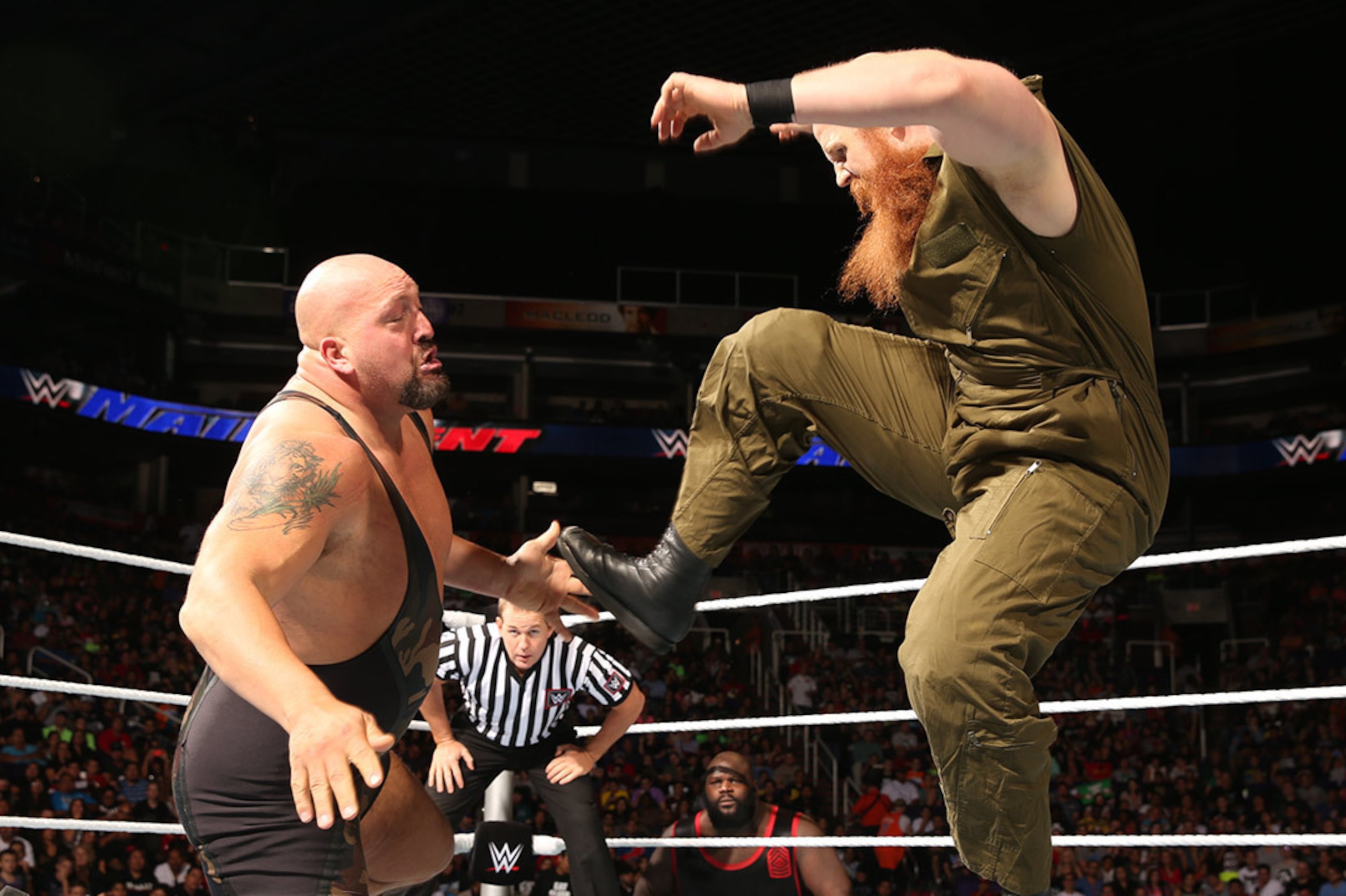 Erick Rowan battles Big Show.