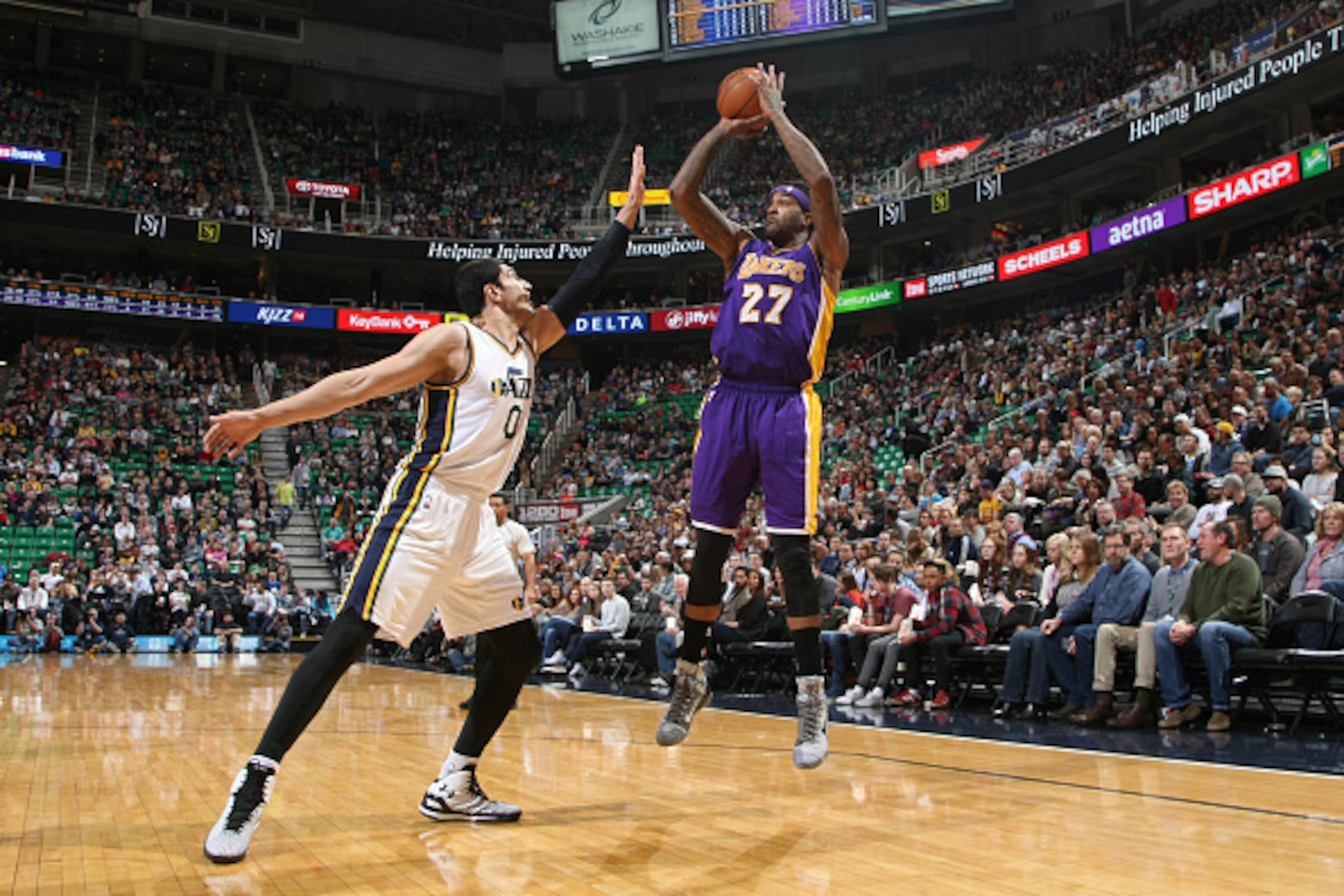 SALT LAKE CITY, UT - JANUARY 16: Jordan Hill #27 of the Los Angeles Lakers shoots against Enes Kanter #0 of the Utah Jazz at EnergySolutions Arena on January 16, 2015 in Salt Lake City, Utah. NOTE TO USER: User expressly acknowledges and agrees that, by d