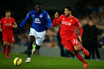 LIVERPOOL, ENGLAND - FEBRUARY 07:  Emre Can of Liverpool and Romelu Lukaku of Everton battle for the ball during the Barclays Premier League match between Everton and Liverpool at Goodison Park on February 7, 2015 in Liverpool, England.  (Photo by Richard