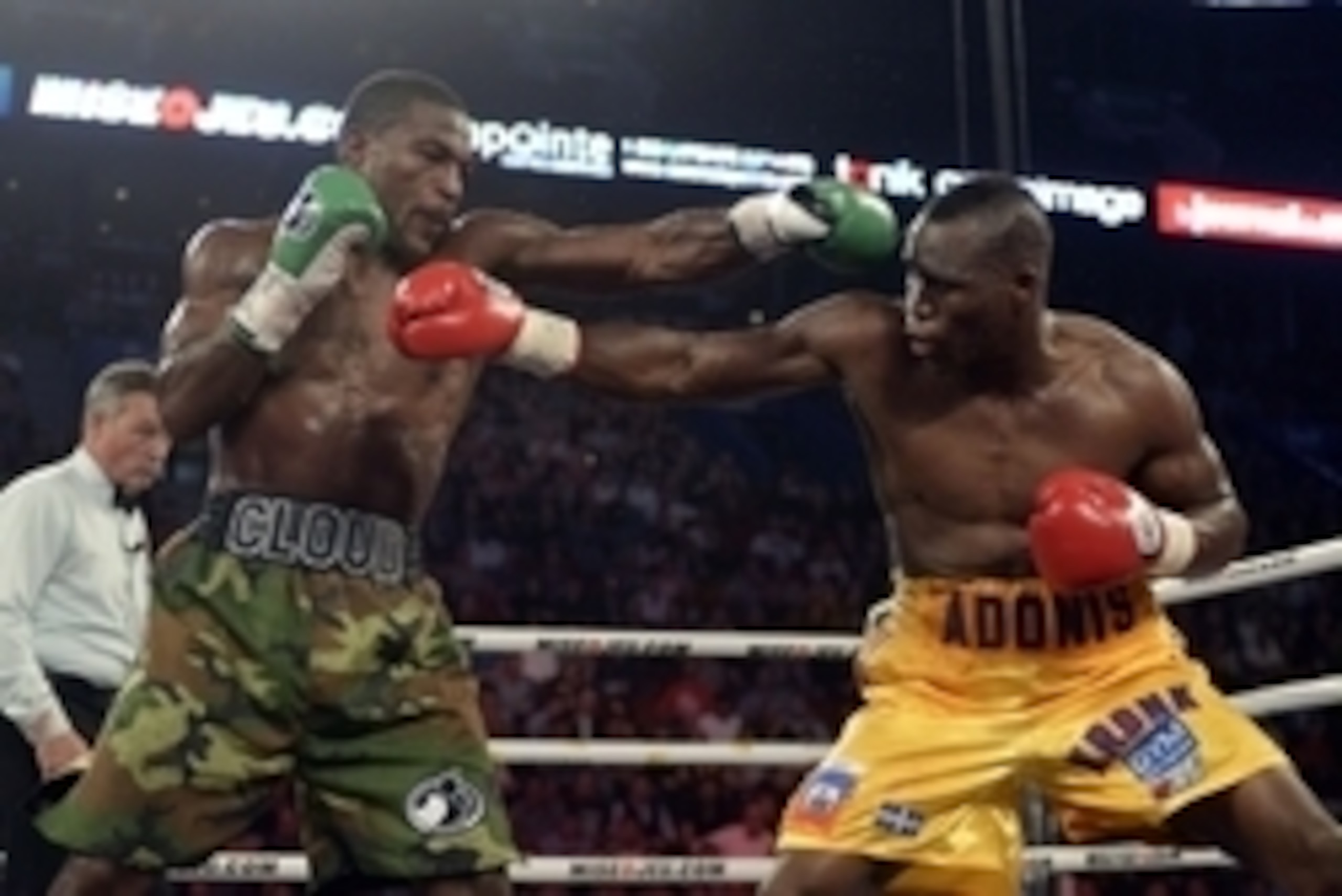 Sep 28, 2013; Montreal, Quebec, Canada;  Adonis Stevenson (yellow trunks) and Tavoris Cloud (cammo trunks) box during their light-heavyweight WBC world championship bout at the Bell Centre. Mandatory Credit: Eric Bolte-USA TODAY Sports