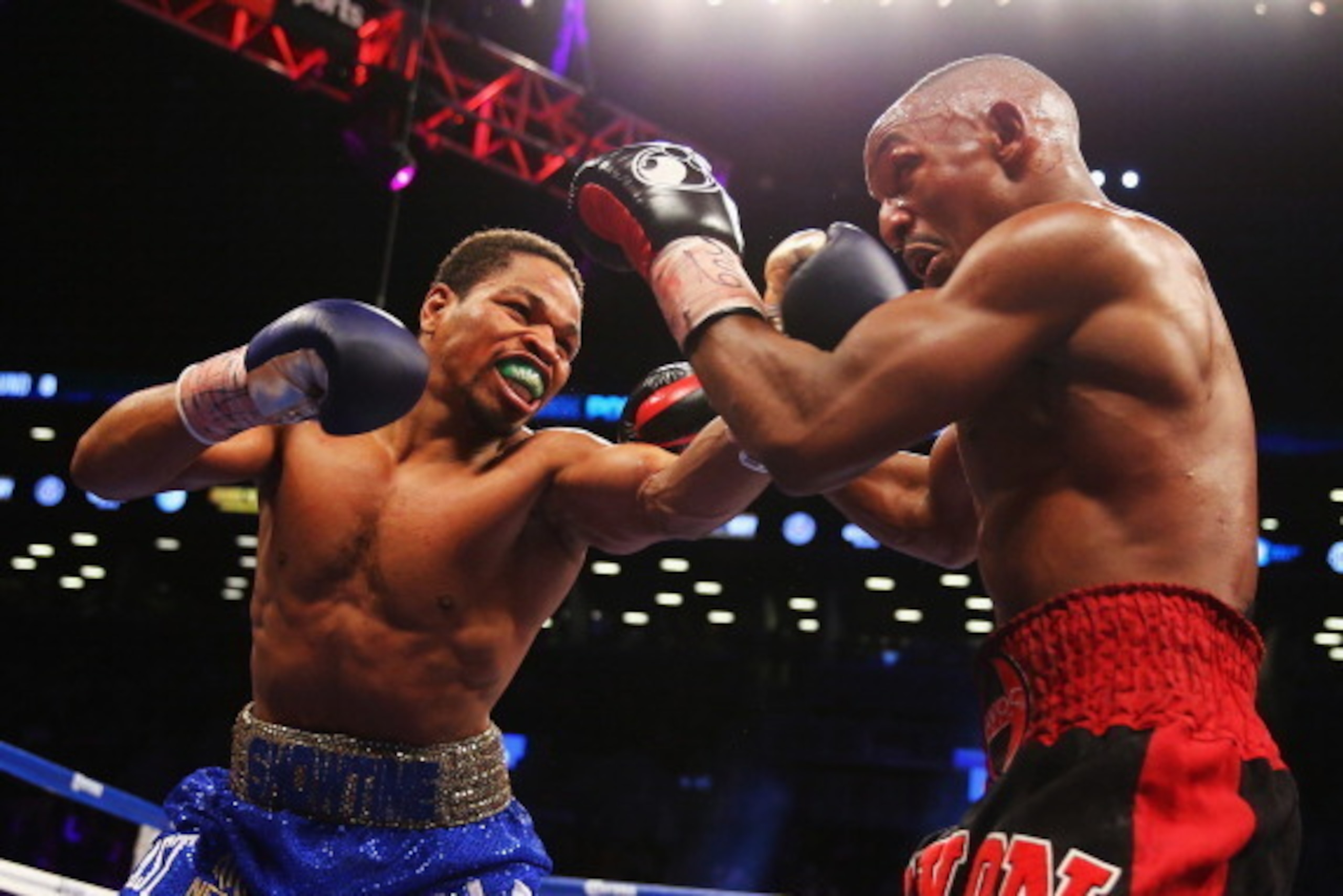 NEW YORK, NY - DECEMBER 07:  Shawn Porter  punches Devon Alexander during their IBF welterweight title fight at the Barclays Center on December 7, 2013 in the Brooklyn Borough of New York City.  (Photo by Al Bello/Getty Images)