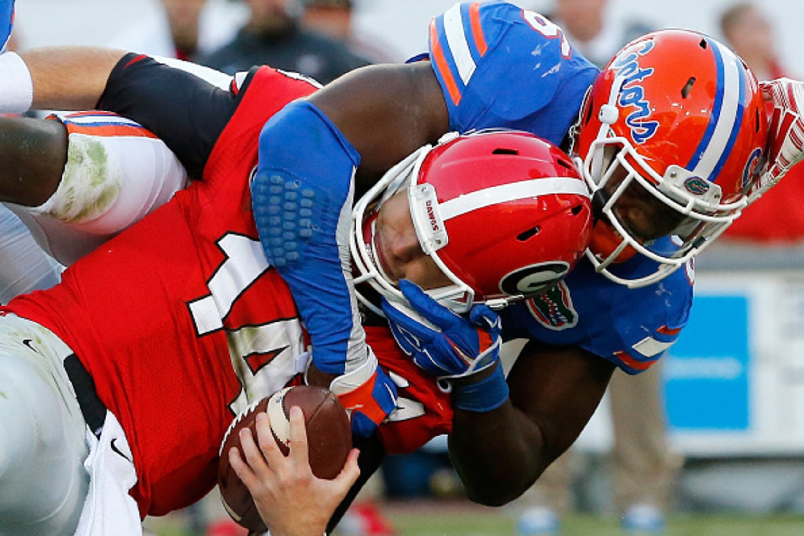JACKSONVILLE, FL - NOVEMBER 01:  Dante Fowler #6 of the Florida Gators sacks Hutson Mason #14 of the Georgia Bulldogs during the game at EverBank Field on November 1, 2014 in Jacksonville, Florida.  (Photo by Sam Greenwood/Getty Images)