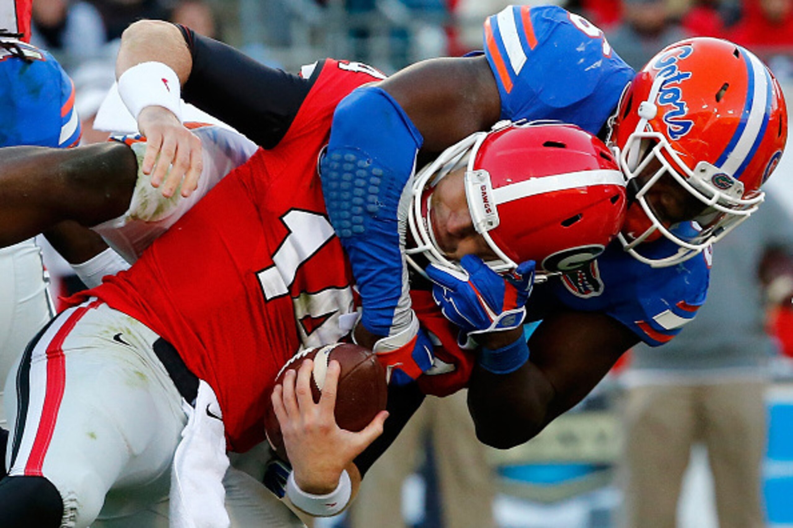 JACKSONVILLE, FL - NOVEMBER 01:  Dante Fowler #6 of the Florida Gators sacks Hutson Mason #14 of the Georgia Bulldogs during the game at EverBank Field on November 1, 2014 in Jacksonville, Florida.  (Photo by Sam Greenwood/Getty Images)