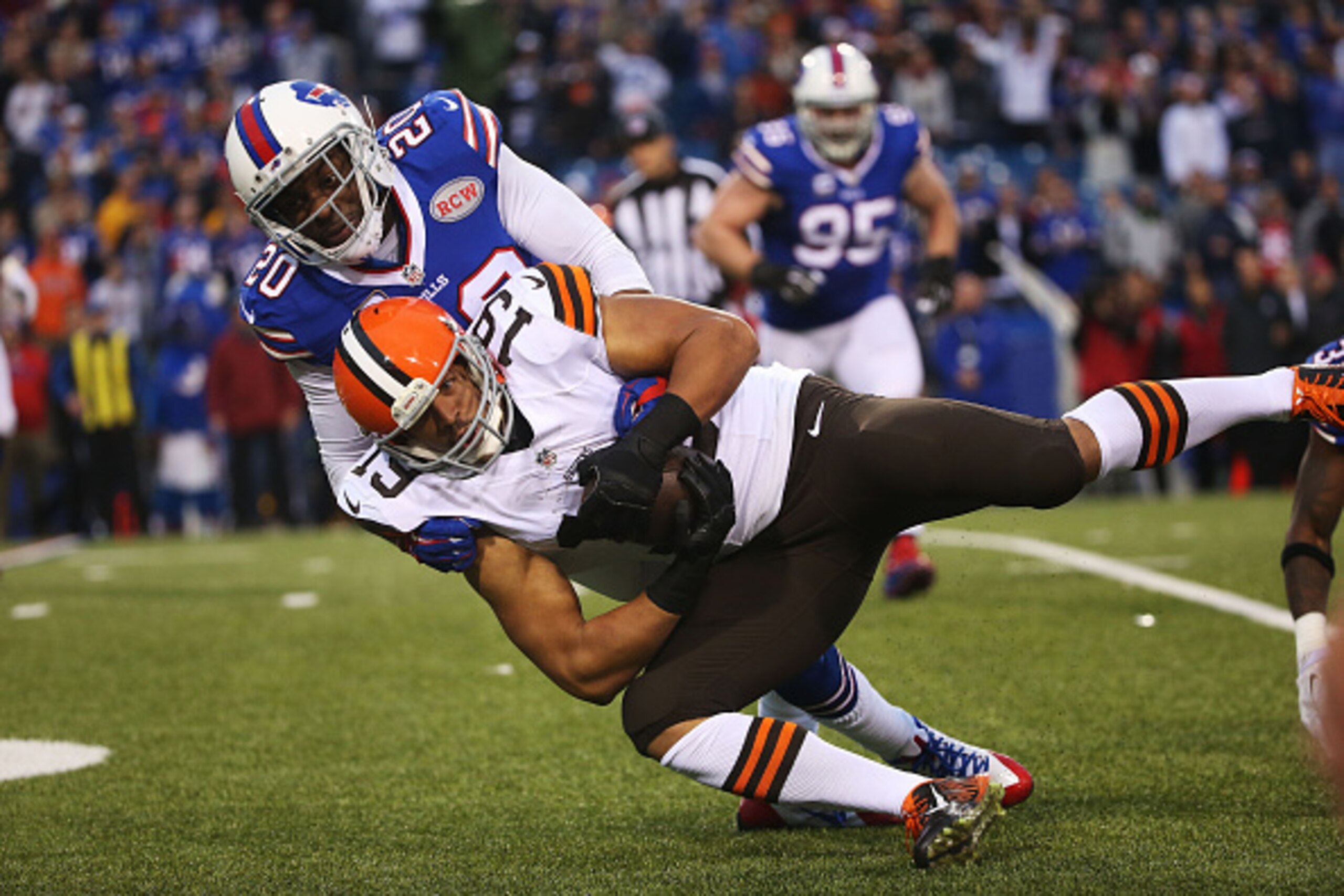 ORCHARD PARK, NY - NOVEMBER 30:   Miles Austin #19 of the Cleveland Browns makes a catch against Corey Graham #20 of the Buffalo Bills during the second half at Ralph Wilson Stadium on November 30, 2014 in Orchard Park, New York.  (Photo by Tom Szczerbows