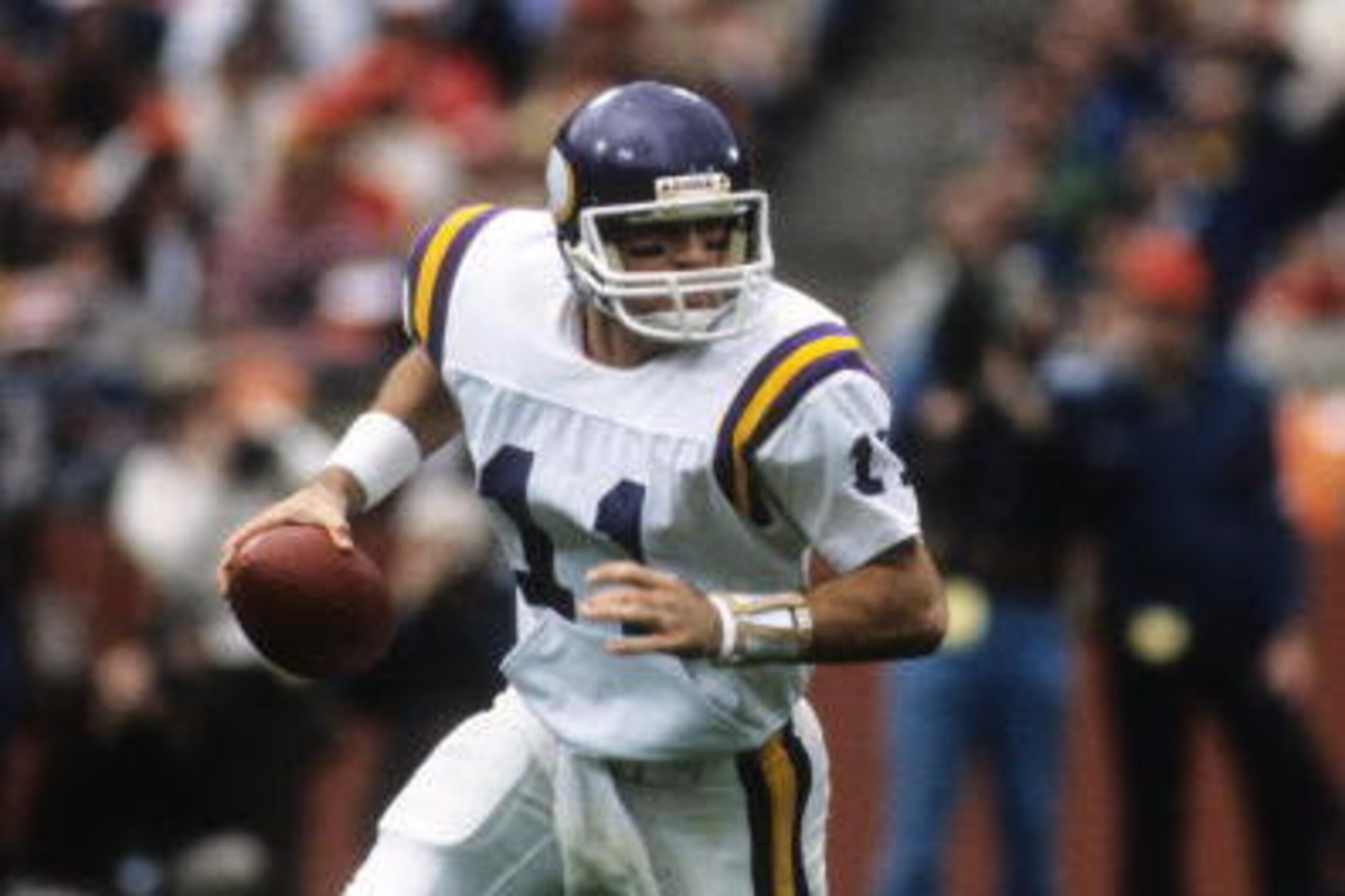 SAN FRANCISCO - DECEMBER 8:  Quarterback Wade Wilson #11 of the Minnesota Vikings looks to make a play during the game against the San Francisco 49ers at Candlestick Park on December 8, 1984 in San Francisco, California.  The 49ers won 51-7.  (Photo by Ge