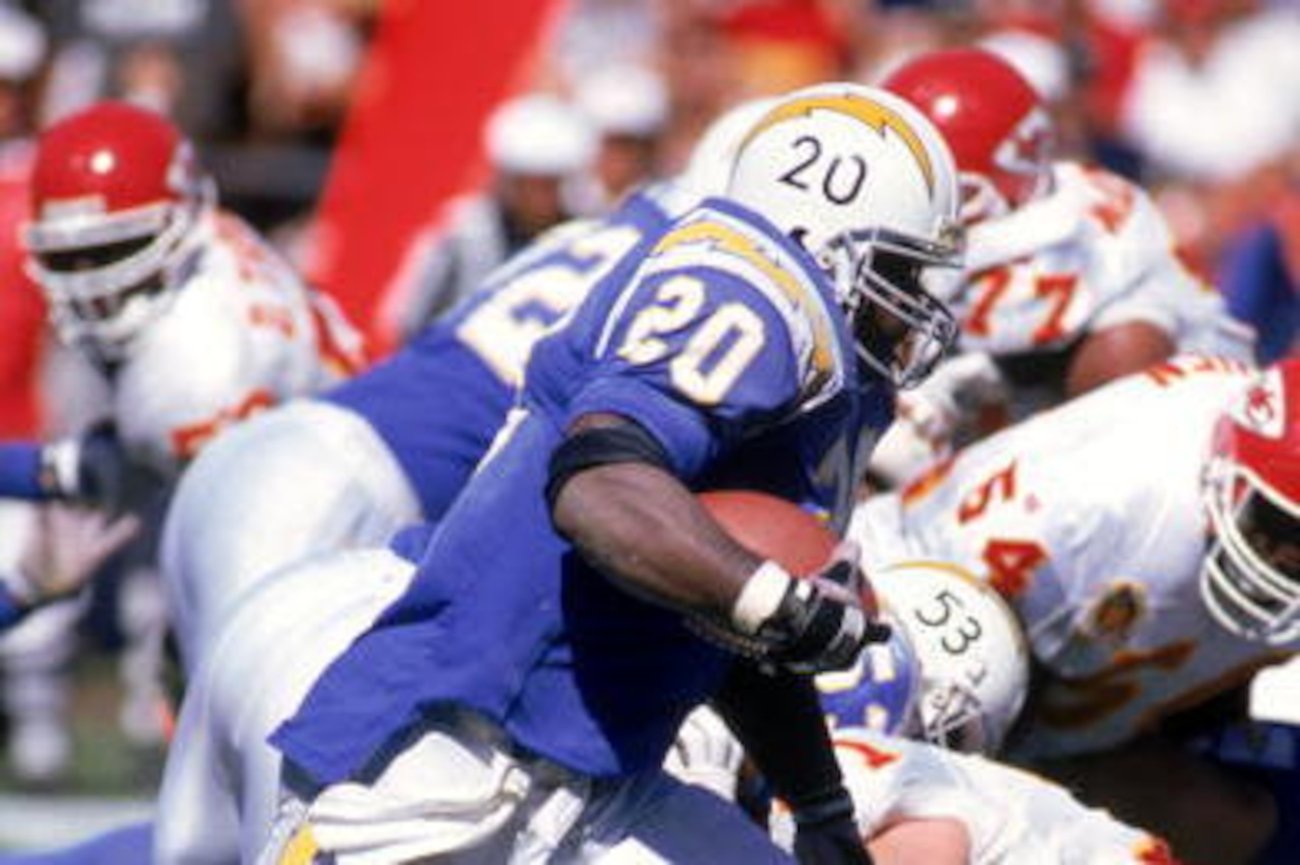 SAN DIEGO - OCTOBER 9:  Running back Natrone Means #20 of the San Diego Chargers rushes for yards against Kansas City Chiefs defense during a game at Jack Murphy Stadium on October 9, 1994 in San Diego, California.  The Chargers won 20-6.  (Photo by Georg