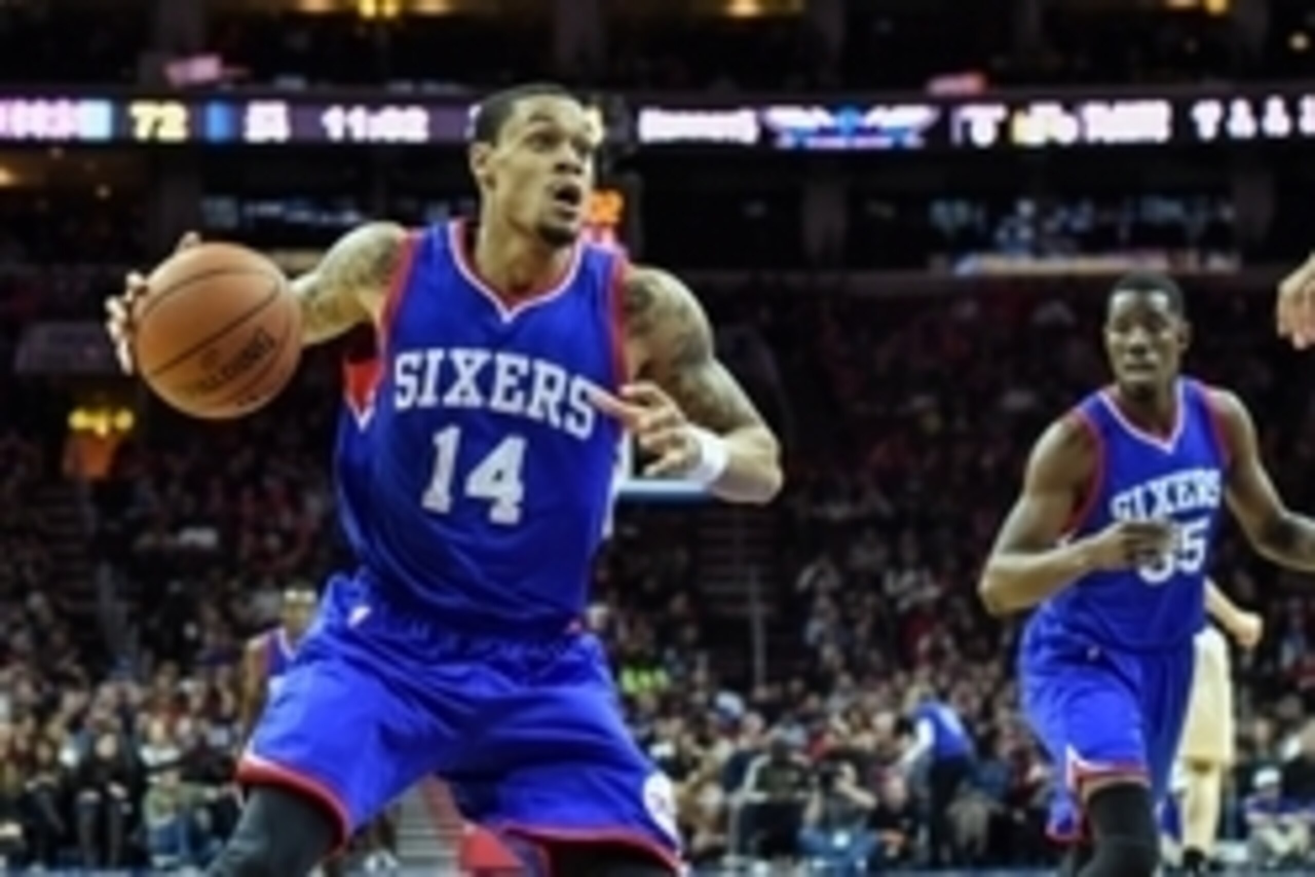 Feb 7, 2015; Philadelphia, PA, USA; Philadelphia 76ers guard K.J. McDaniels (14) looks to shoot during the fourth quarter of the game against the Charlotte Hornets at the Wells Fargo Center. The Sixers beat the Hornets 89-81. Mandatory Credit: John Gelieb