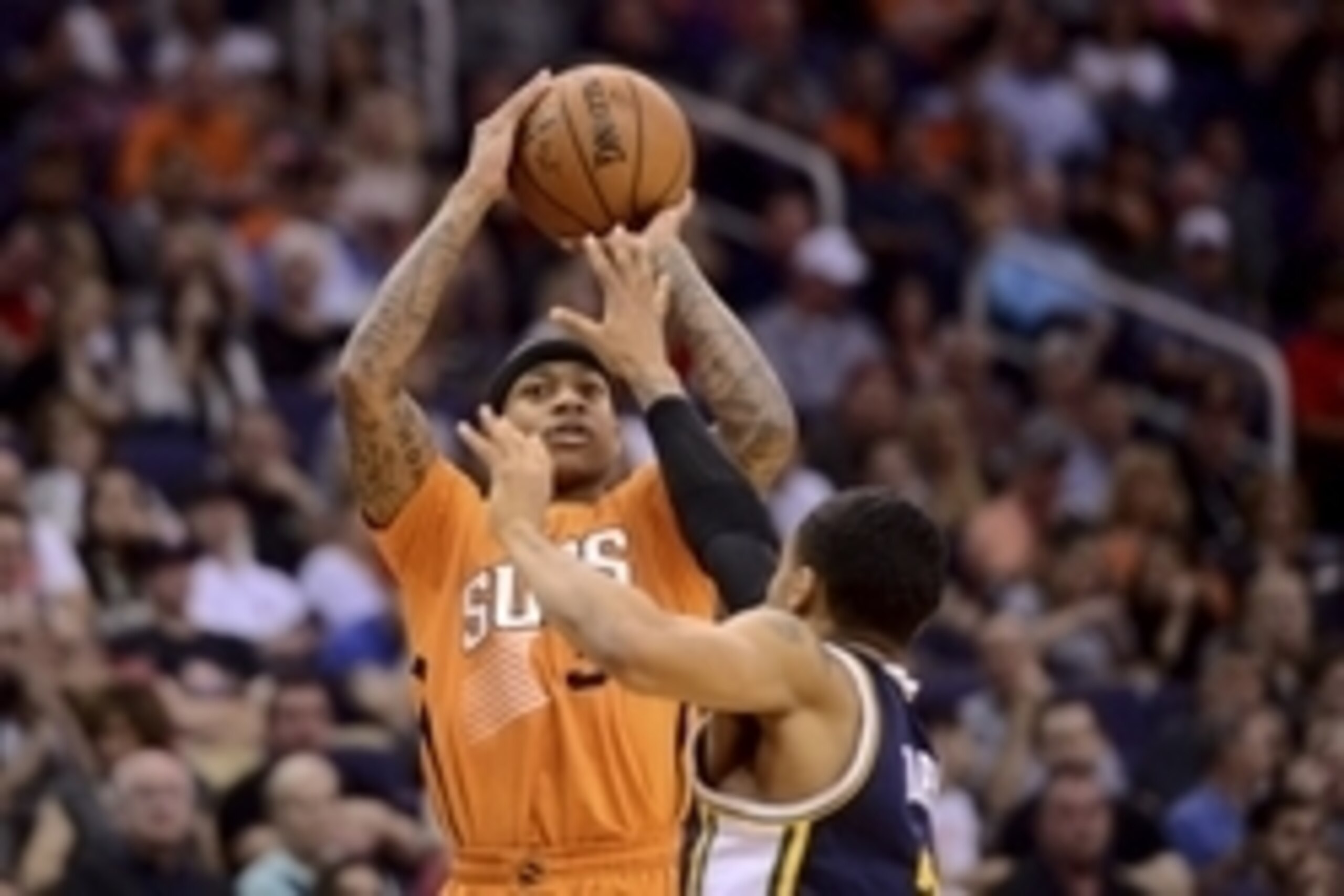 Feb 6, 2015; Phoenix, AZ, USA; Phoenix Suns guard Isaiah Thomas (3) takes a jump shot against the Utah Jazz during the second half at US Airways Center. The Suns won 100-93. Mandatory Credit: Joe Camporeale-USA TODAY Sports