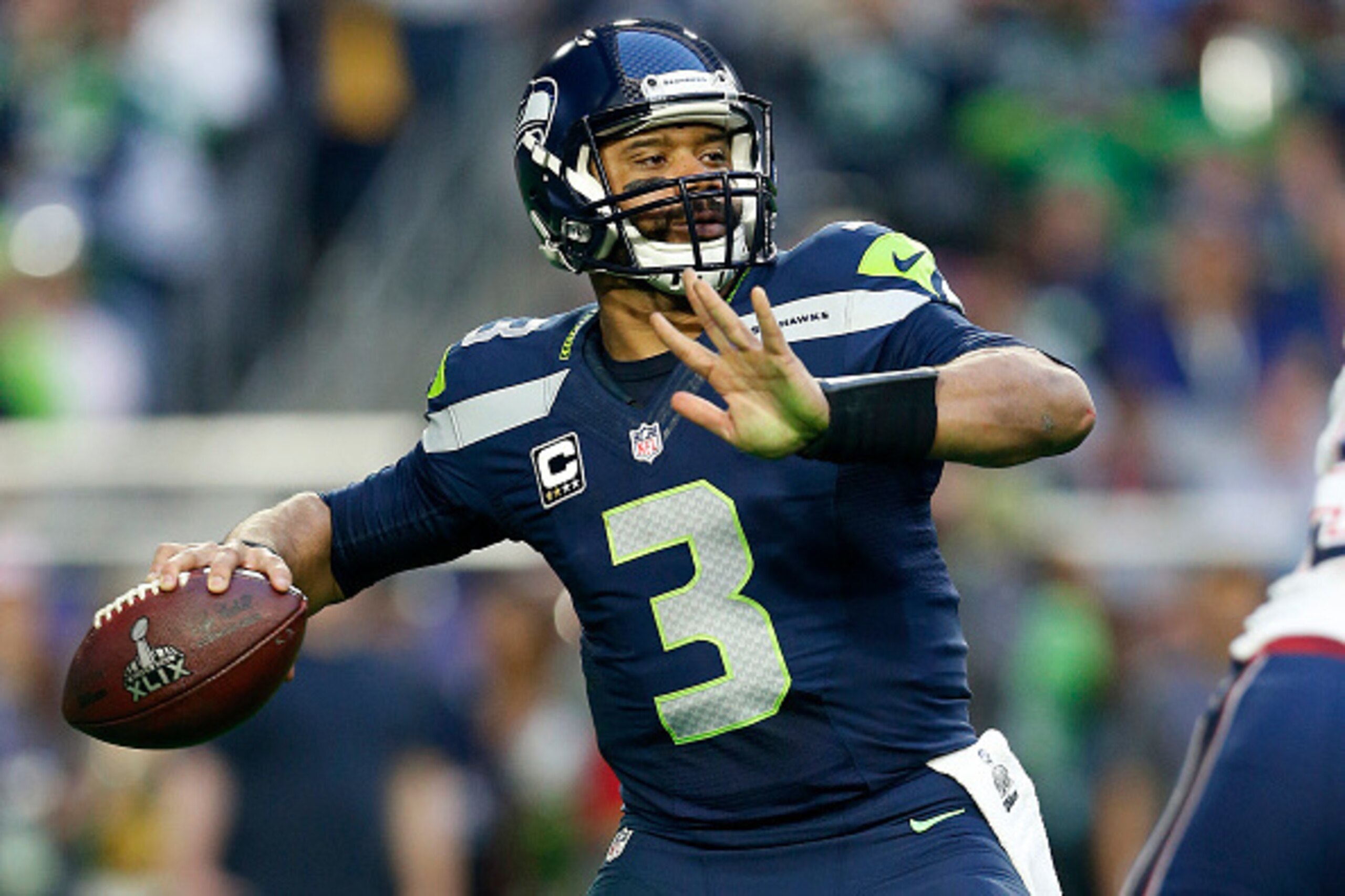 GLENDALE, AZ - FEBRUARY 01:  Russell Wilson #3 of the Seattle Seahawks looks to pass against the New England Patriots during Super Bowl XLIX at University of Phoenix Stadium on February 1, 2015 in Glendale, Arizona.  (Photo by Christian Petersen/Getty Ima