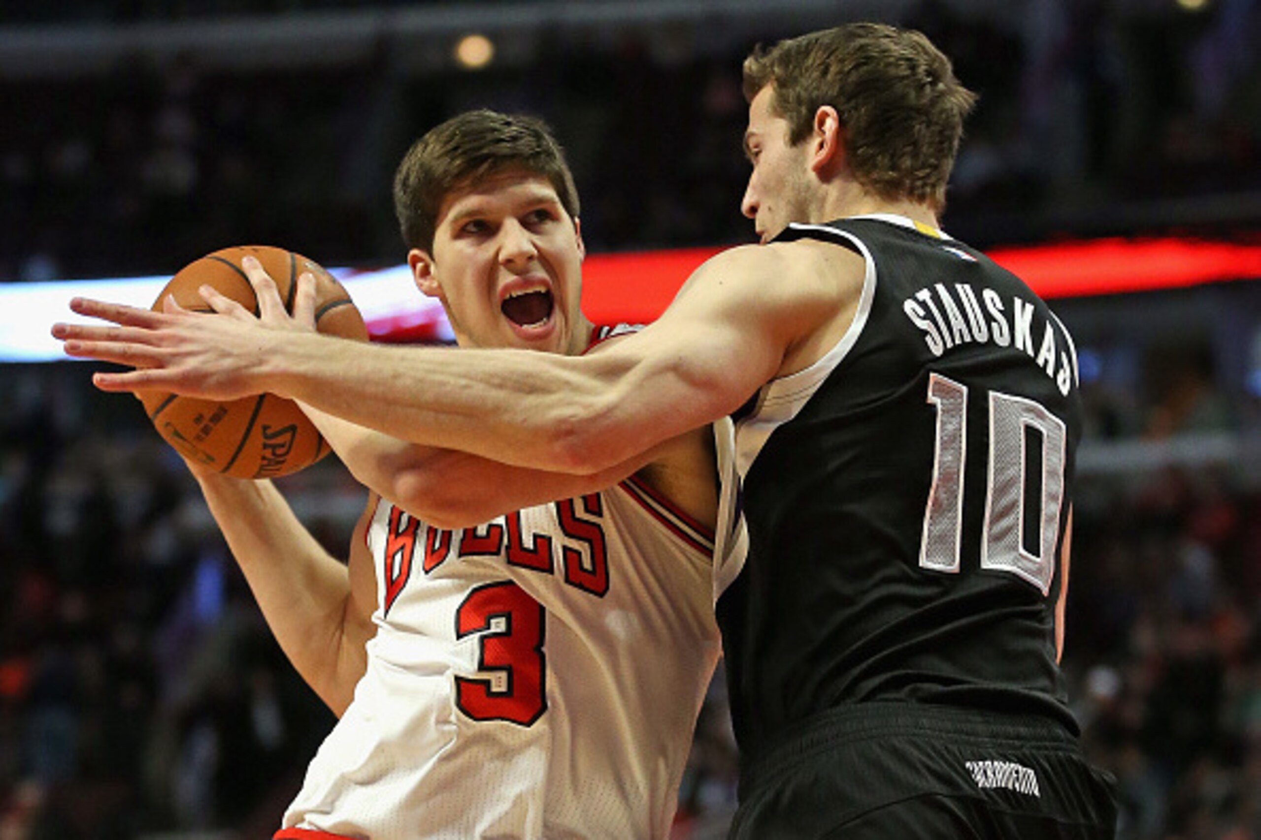CHICAGO, IL - FEBRUARY 10: Doug McDermott #3 of the Chicago Bulls is fouled by Nik Stauskas #10 of the Sacramento Kings at United Center on February 10, 2015 in Chicago, Illinois. The Bulls defeated the Kings 104-86. NOTE TO USER: User expressly acknowled