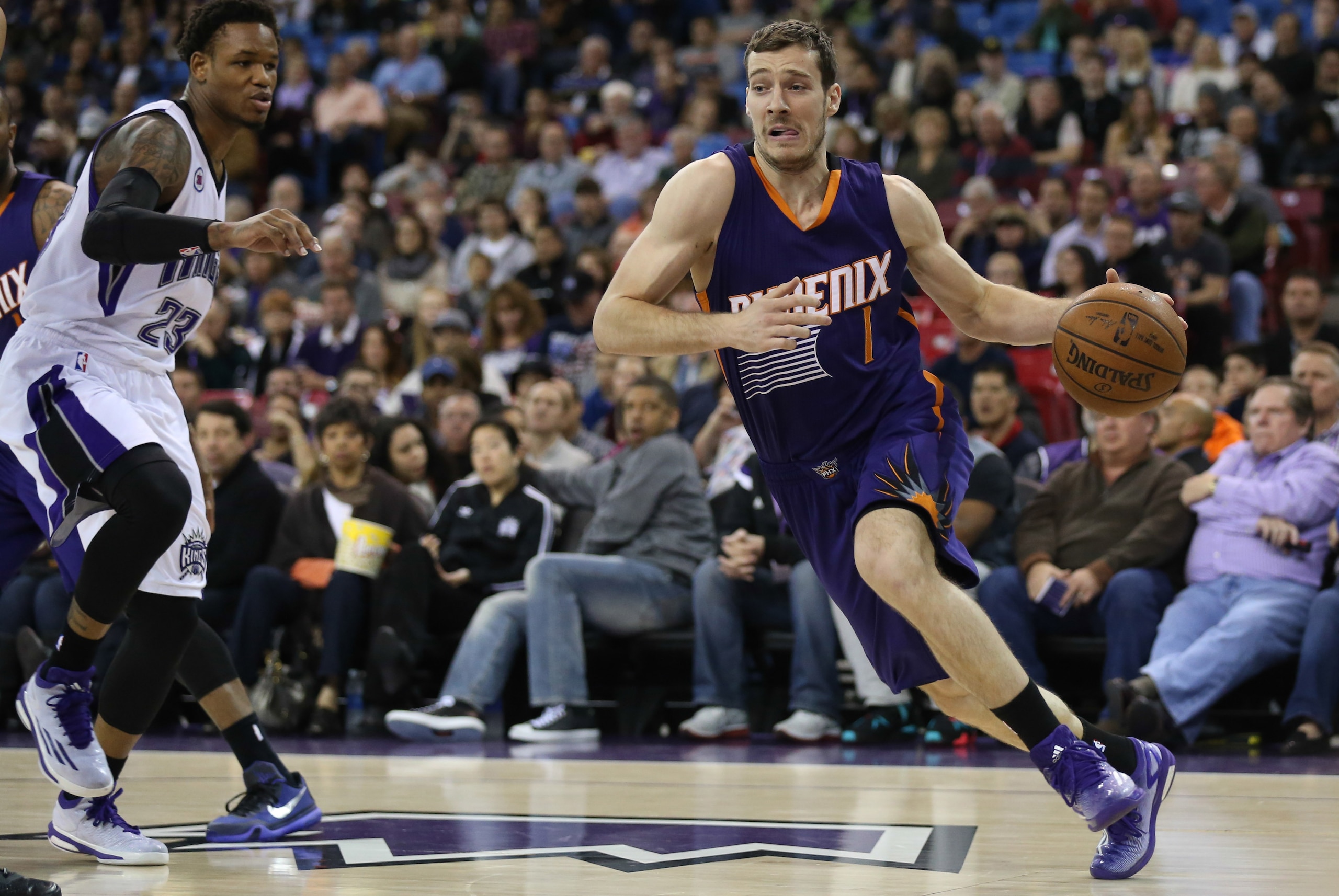 Feb 8, 2015; Sacramento, CA, USA; Phoenix Suns guard Goran Dragic (1) drives baseline against Sacramento Kings guard Ben McLemore (23) during the first quarter at Sleep Train Arena. Mandatory Credit: Kelley L Cox-USA TODAY Sports