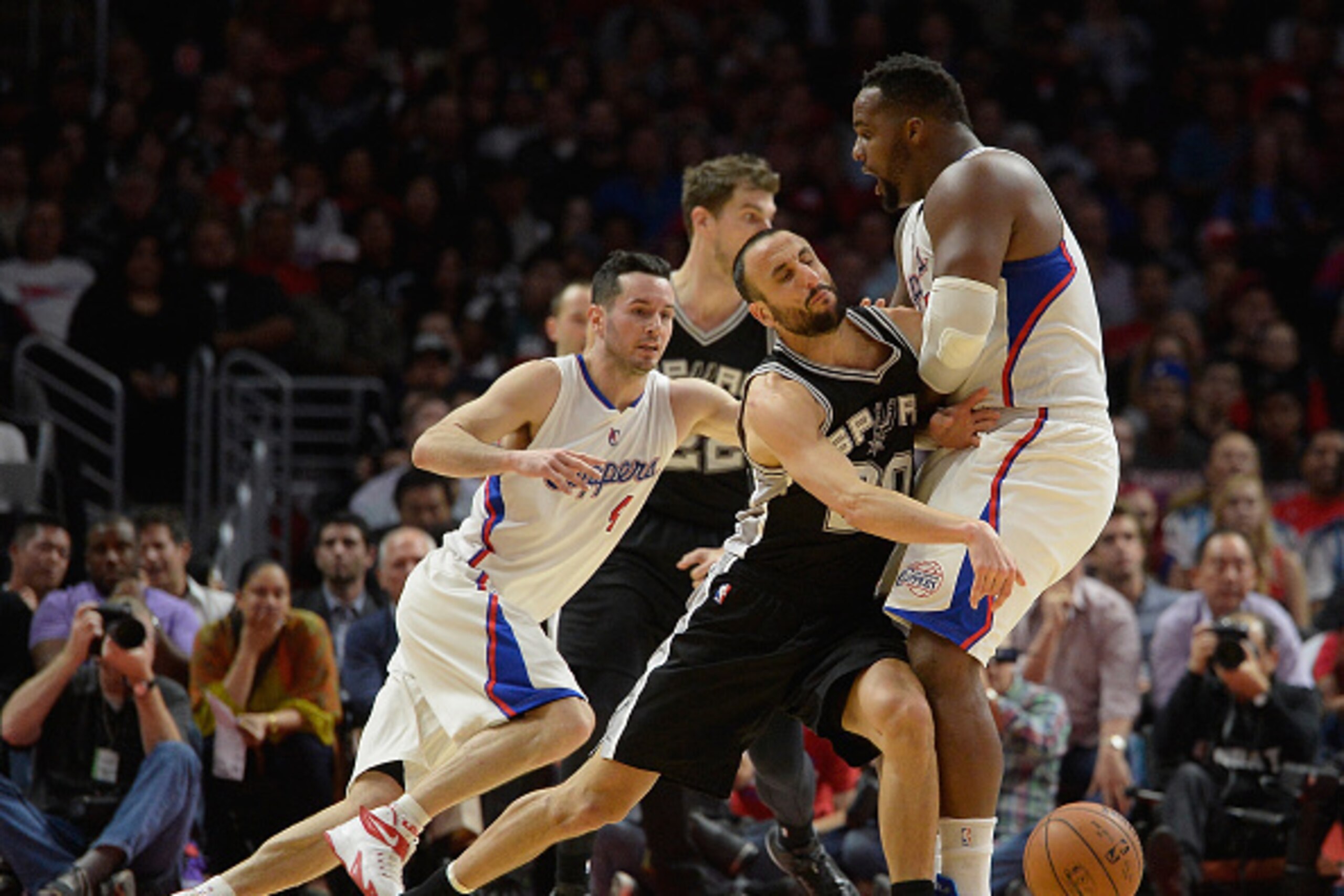 LOS ANGELES, CA - FEBRUARY 19: Manu Ginobili #20 of the San Antonio Spurs runs into Glen Davis #0 of the Los Angeles Clippers as he is chased by J.J. Redick #4 at Staples Center on February 19, 2015 in Los Angeles, California. NOTE TO USER: User express LOS ANGELES, CA - FEBRUARY 19: Manu Ginobili #20 of the San Antonio Spurs runs into Glen Davis #0 of the Los Angeles Clippers as he is chased by J.J. Redick #4 at Staples Center on February 19, 2015 in Los Angeles, California. NOTE TO USER: User express