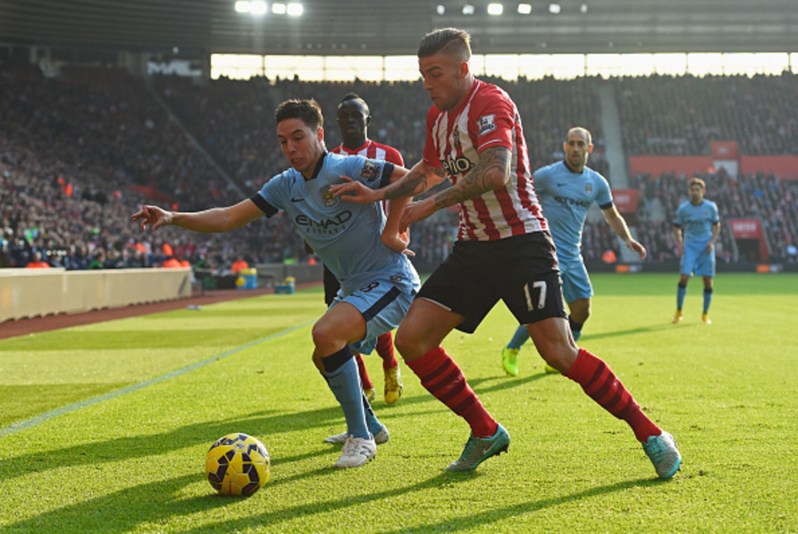 SOUTHAMPTON, ENGLAND - NOVEMBER 30:  Samir Nasri of Manchester City holds off Toby Alderweireld of Southampton during the Barclays Premier League match between Southampton and Manchester City at St Mary's Stadium on November 30, 2014 in Southampton, Engla