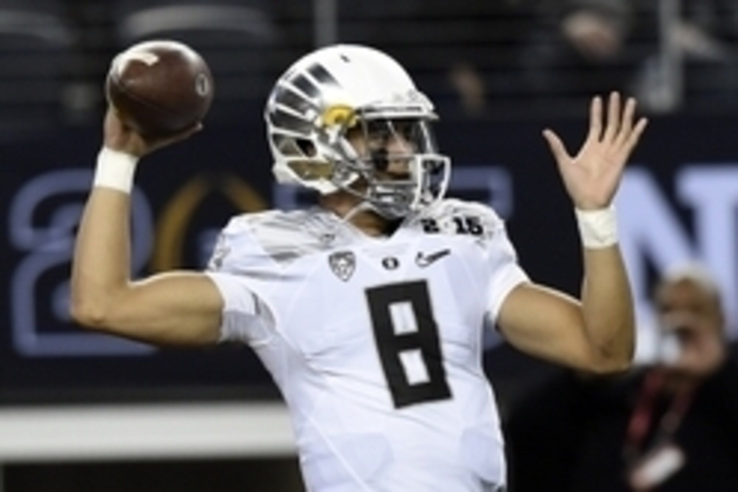 Jan 12, 2015; Arlington, TX, USA; Oregon Ducks quarterback Marcus Mariota (8) warms up before the game against the Ohio State Buckeyes in the 2015 CFP National Championship Game at AT&T Stadium. Mandatory Credit: Tommy Gilligan-USA TODAY Sports