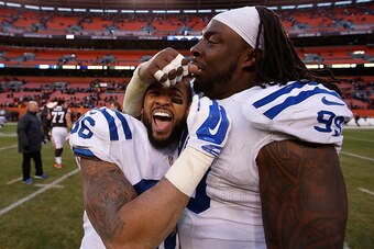 CLEVELAND, OH - DECEMBER 07:  Dan Herron #36 celebrates with Ricky Jean Francois #99 of the Indianapolis Colts after their 25-24 win over the Cleveland Browns at FirstEnergy Stadium on December 7, 2014 in Cleveland, Ohio.  (Photo by Joe Robbins/Getty Imag