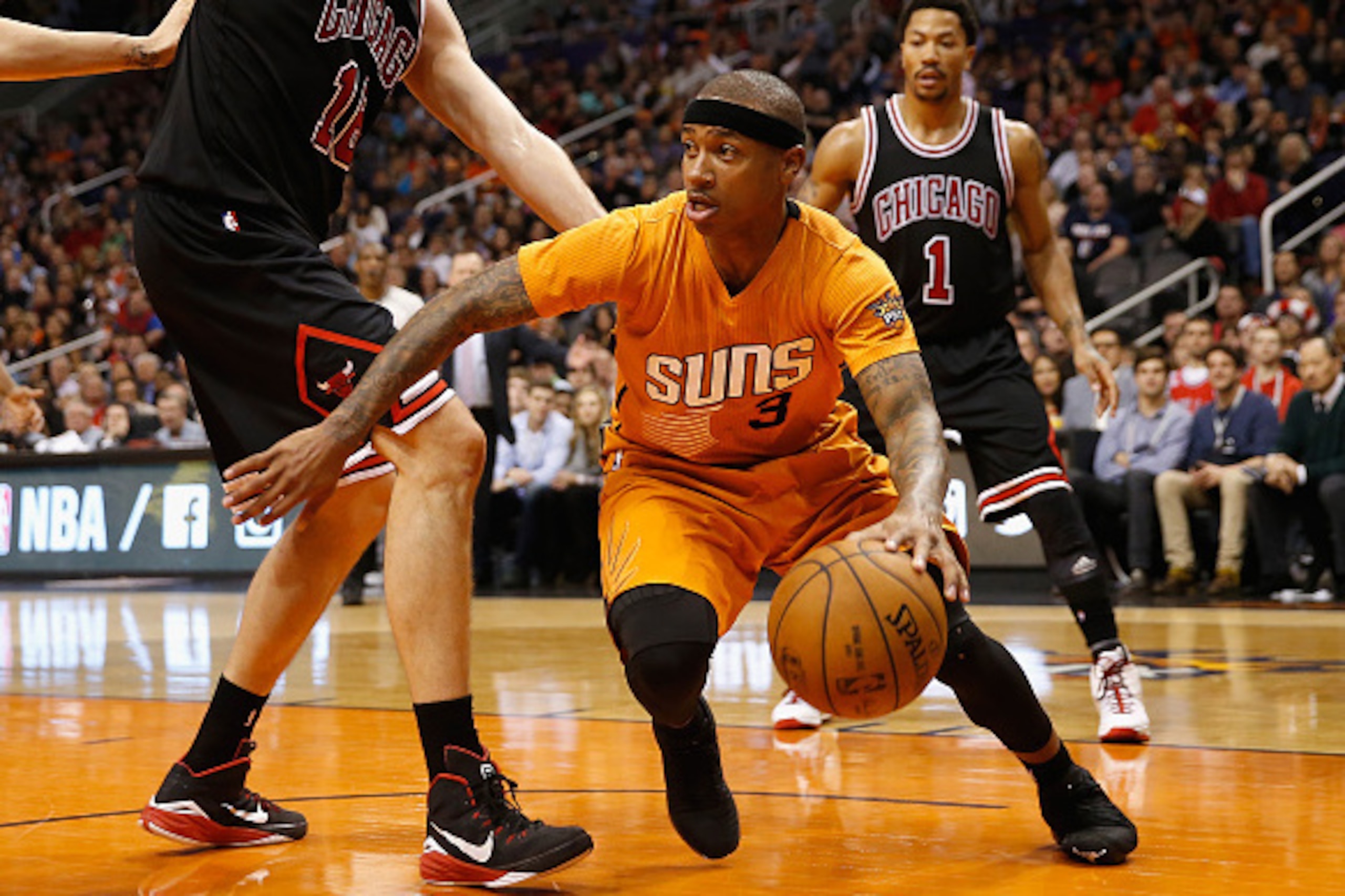 PHOENIX, AZ - JANUARY 30:  Isaiah Thomas #3 of the Phoenix Suns handles the ball during the NBA game against the Chicago Bulls at US Airways Center on January 30, 2015 in Phoenix, Arizona. The Suns defeated the Bulls 99-93.  NOTE TO USER: User expressly a