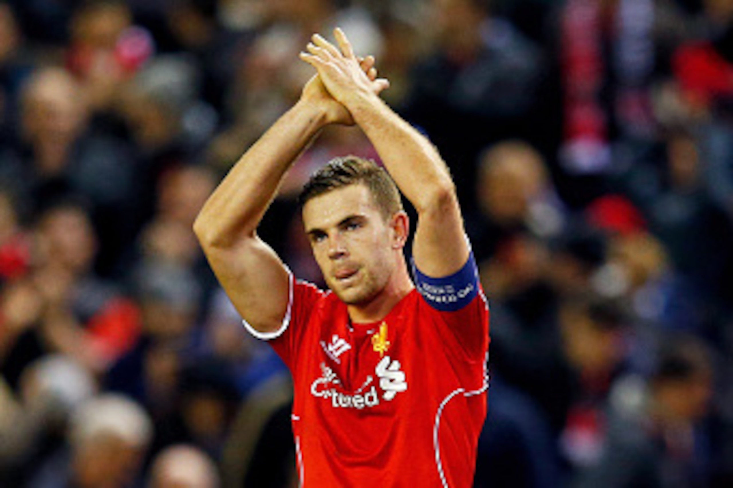 LIVERPOOL, ENGLAND - FEBRUARY 19:  Jordan Henderson of Liverpool applauds the home fans following their team's 1-0 victory during the UEFA Europa League Round of 32 match between Liverpool FC and Besiktas JK at Anfield on February 19, 2015 in Liverpool, U