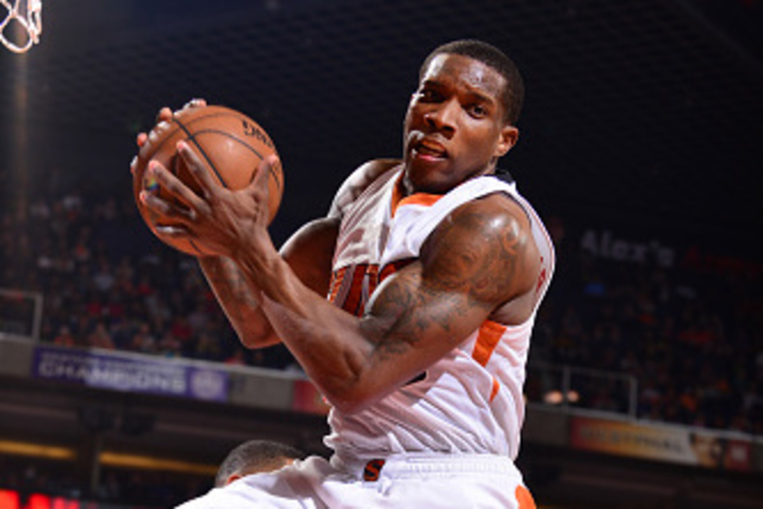 PHOENIX, AZ -  FEBRUARY 10: Eric Bledsoe #2 of the Phoenix Suns grabs the rebound against the Houston Rockets during the game on February 10, 2015 at US Airways Center in Phoenix, Arizona. NOTE TO USER: User expressly acknowledges and agrees that, by down