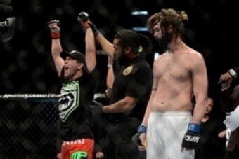 December 14, 2013; Sacramento, CA, USA; Sam Stout (red gloves) defeats Cody McKenzie (blue gloves) during the lightweight bout of the UFC on FOX 9 at Sleep Train Arena. Mandatory Credit: Kyle Terada-USA TODAY Sports