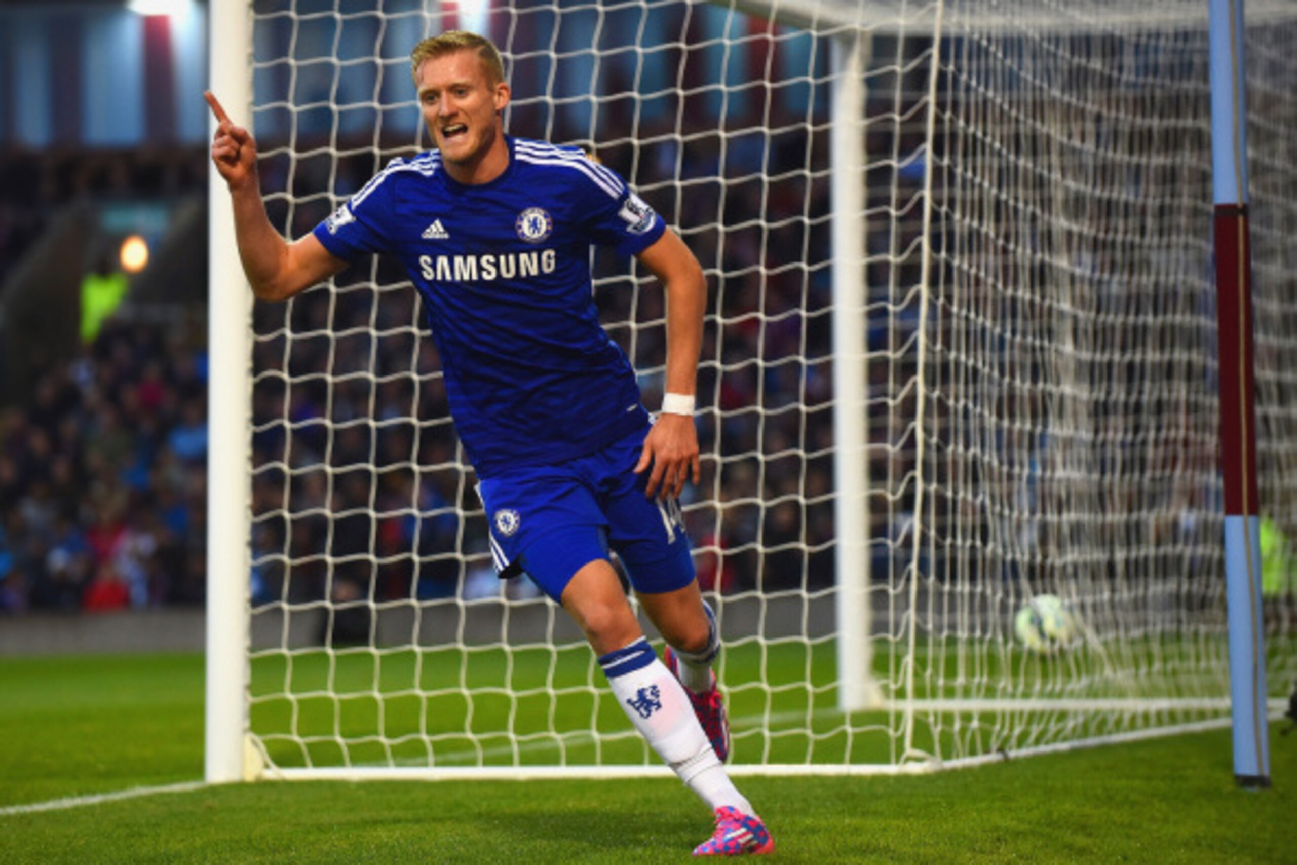 BURNLEY, ENGLAND - AUGUST 18:  Andre Schurrle of Chelsea celebrates scoring their second goal during the Barclays Premier League match between Burnley and Chelsea at Turf Moor on August 18, 2014 in Burnley, England.  (Photo by Laurence Griffiths/Getty Ima