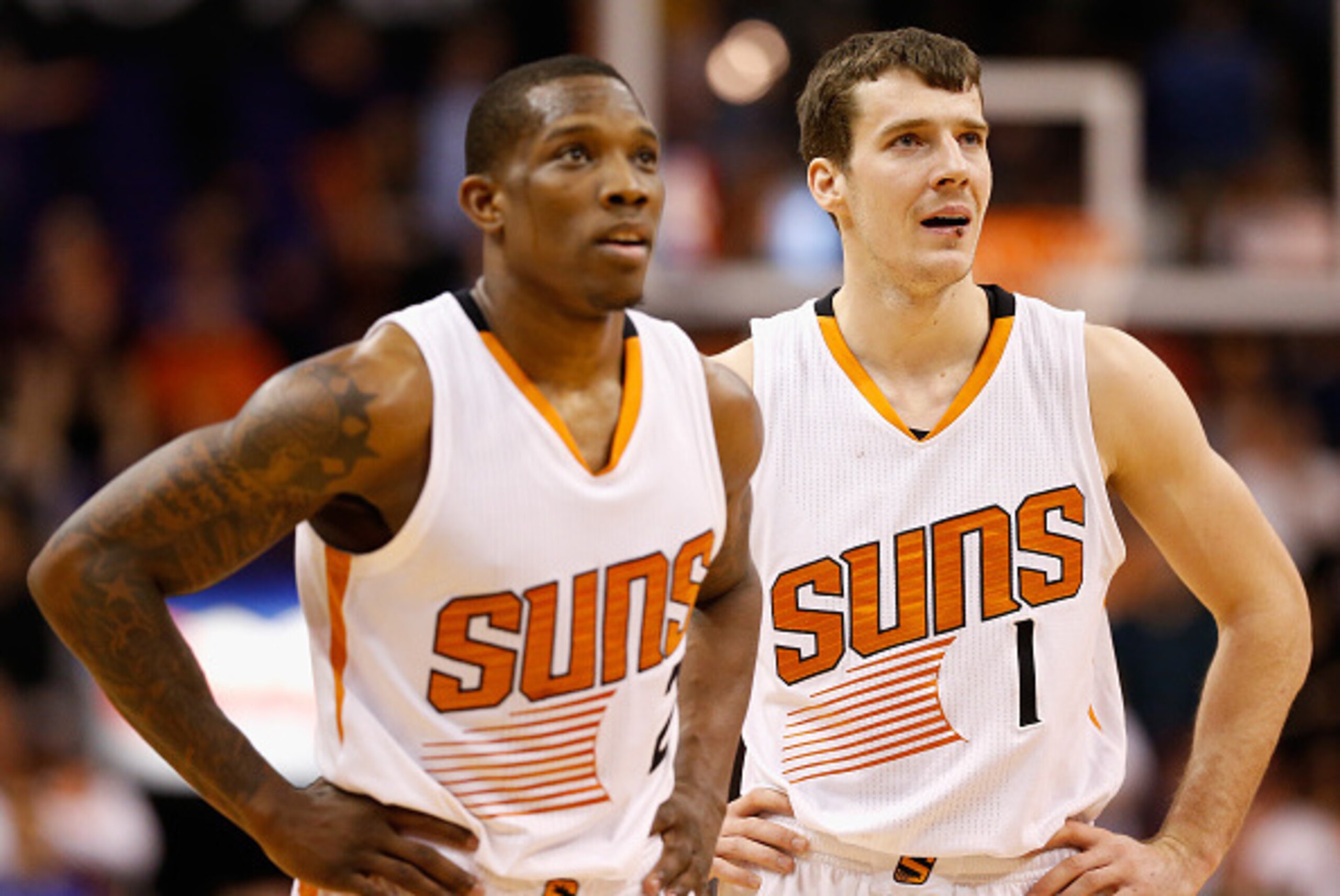 PHOENIX, AZ - JANUARY 21: Eric Bledsoe #2 and Goran Dragic #1 of the Phoenix Suns look on during a break from the NBA game against the Portland Trail Blazers at US Airways Center on January 21, 2015 in Phoenix, Arizona. The Suns defeated the Trail Blazer PHOENIX, AZ - JANUARY 21: Eric Bledsoe #2 and Goran Dragic #1 of the Phoenix Suns look on during a break from the NBA game against the Portland Trail Blazers at US Airways Center on January 21, 2015 in Phoenix, Arizona. The Suns defeated the Trail Blazer
